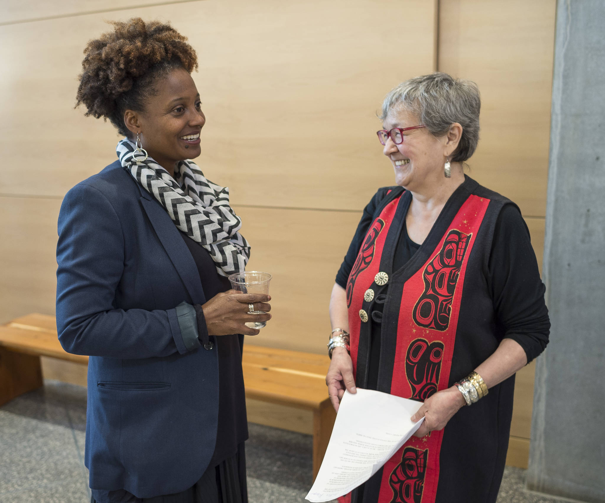 Tracy K. Smith, the 52nd Poet Laureate of the United States, is greeted by Alaska State Writer Laureate Ernestine Hayes before Smith’s reading at the Andrew P. Kashevaroff Building on Wednesday, Aug. 29, 2018. (Michael Penn | Juneau Empire)