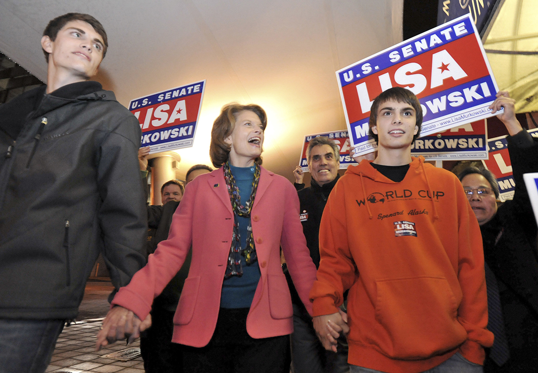 This Nov. 2, 2010 file photo shows U.S. Sen. Lisa Murkowski, R-Alaska, walking to Election Central in Anchorage with her sons Nick, left, and Matt. The election night tradition in Alaska of candidates of all parties milling about at Election Central awaiting election results or going there for media interviews has ended.