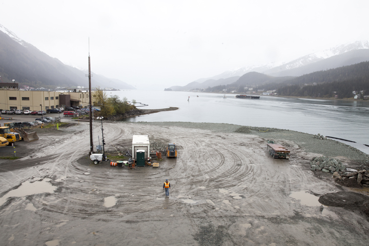 A city worker walks along a site that will soon host a life-sized whale sculpture and bridge park project along the Gastineau Channel in Juneau. The city is being sued by a industry representative for 12 cruise lines which alleges that the city is misspending funds from a per-passenger tax on the whale project and others which do not directly benefit cruise passengers.