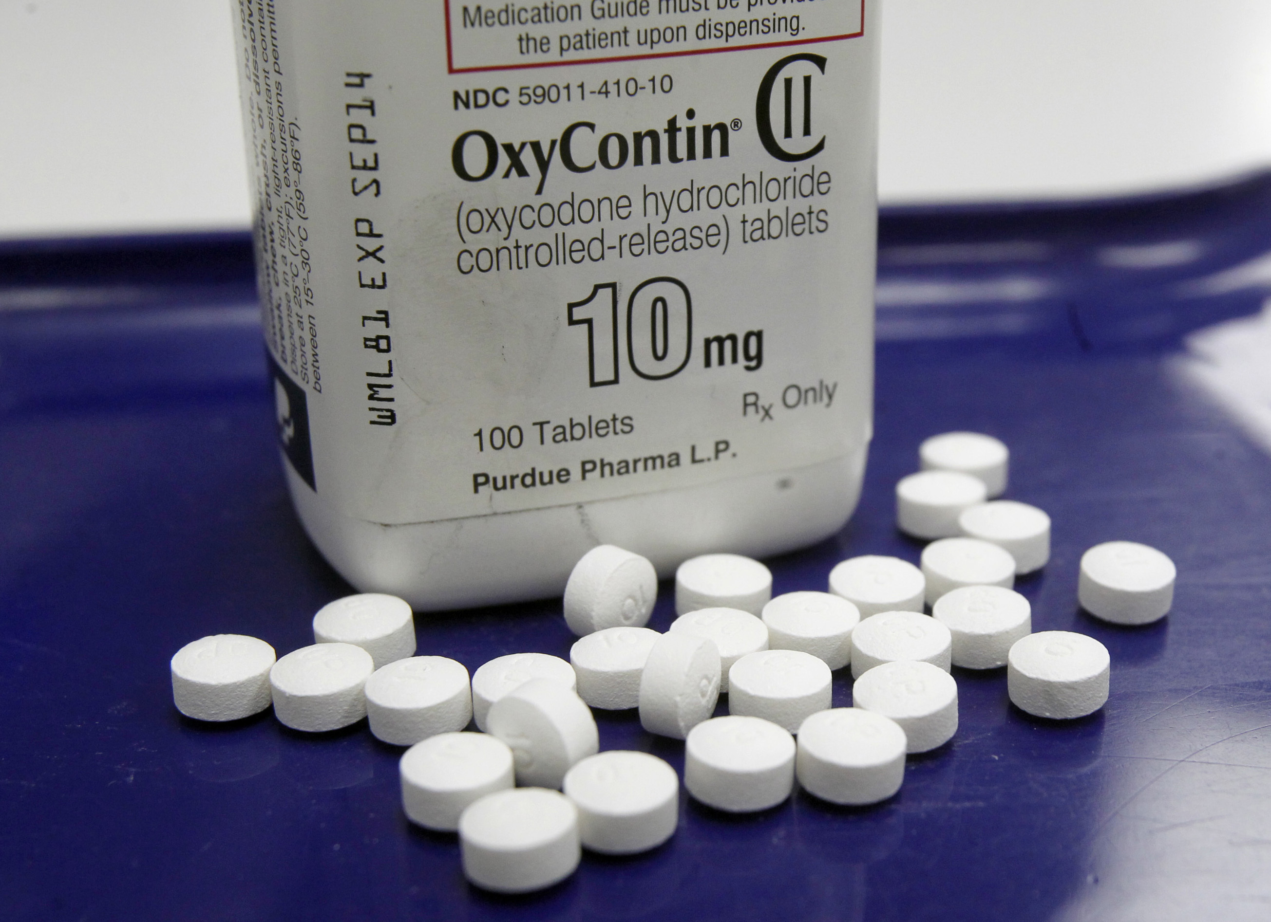 This Feb. 19, 2013, file photo shows OxyContin pills arranged for a photo at a pharmacy in Montpelier, Vt. More than 28,000 Americans died from overdosing on opiates in 2014, a record high for the nation. That’s 78 people per day, a number that doesn’t include the millions of family members, first responders and even taxpayers who feel the ripple of drug addiction in their daily lives. A rise in prescription painkillers is partially to blame: The sale of these drugs has quadrupled since 1999, and so has the number of Americans dying from an addiction to them. When prescriptions run out, people find themselves turning to the cheaper alternative heroin and, increasingly, the even more deadly drug fentanyl.