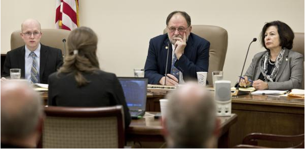 In this file photo taken in November 2015, Rep. Wes Keller, R-Wasilla, center, listens to a bill at the Alaska Capitol.