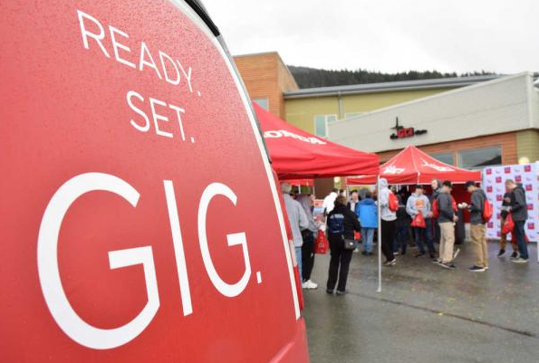 In this file photo taken April 2, 2016, Juneauites crowd the GCI store near Juneau International Airport for the launch of GCI's gigabit internet service.