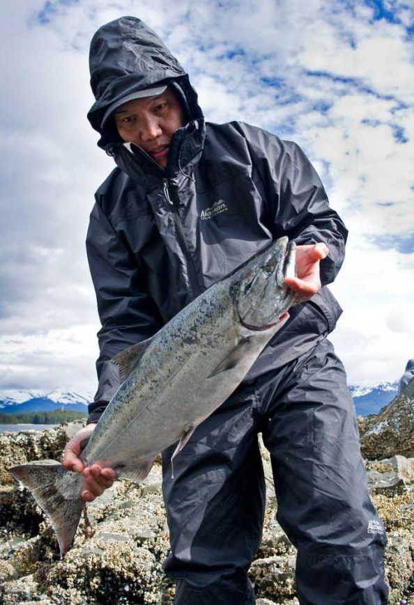 In this file photo from April 2014, J.R. Camba prepares to clean the king salmon he caught at False Outer Point.
