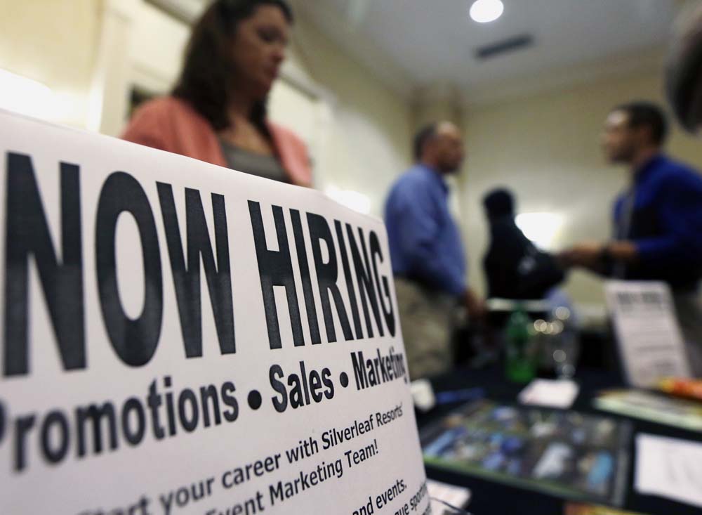 A sign attracts job-seekers during a job fair at the Marriott Hotel in Colonie, N.Y. Unemployment rates fell in 29 states in August and held steady in 11 as hiring remained solid nationwide. Falling oil and coal prices continued to take a toll on energy-producing states.