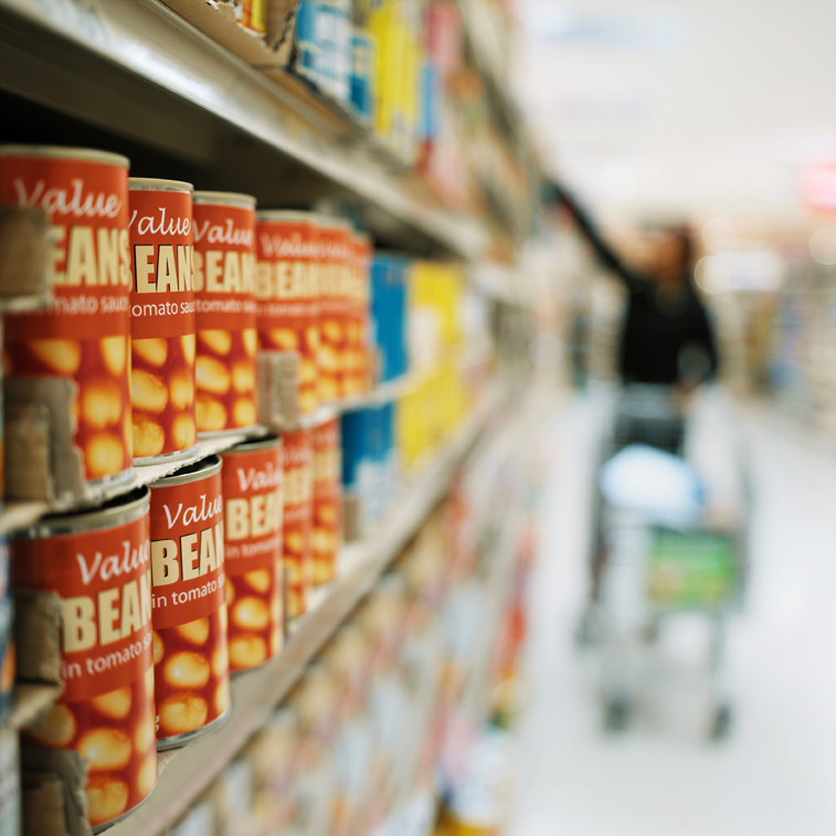 A stock image of canned food in a supermarket