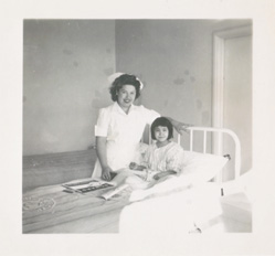 Pat Sarvela, one of the first nurses at Mt. Edgecumbe Hospital works with tuberculosis patient Agnes Prosoff at the Alice Island sanitarium in the late 1940s.