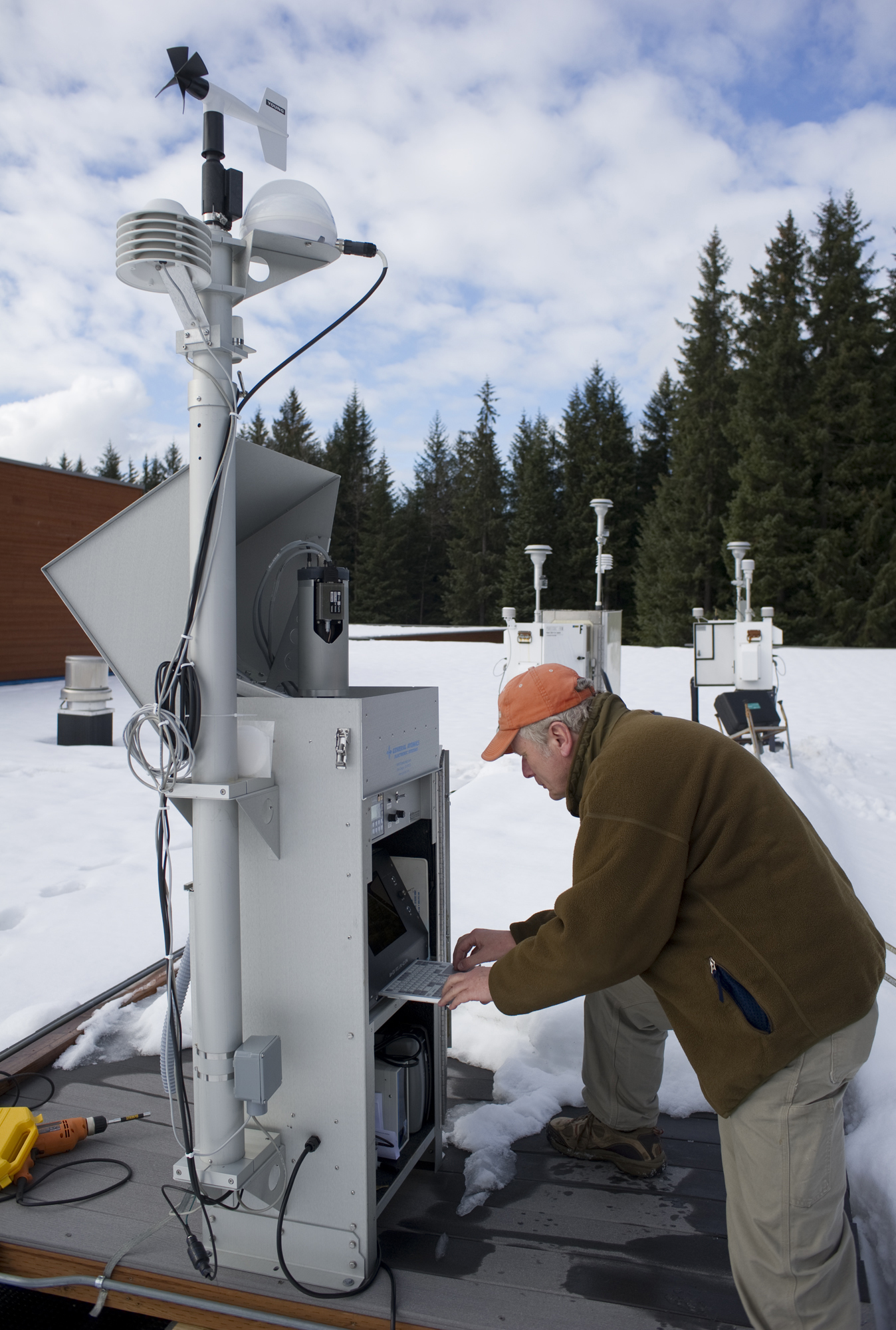 Gus van Vliet of the Air Quality Division of the Alaska Department of Environmental Conservation works on air quality and radiation detection equipment on the roof of the Floyd Dryden Middle School in March 2011. The equipment belongs to the US Environmental Protection Agency and sends its information via modem to its National Air and Radiation Environmental Laboratory in Montgomery, Alabama. (Michael Penn | Juneau Empire)