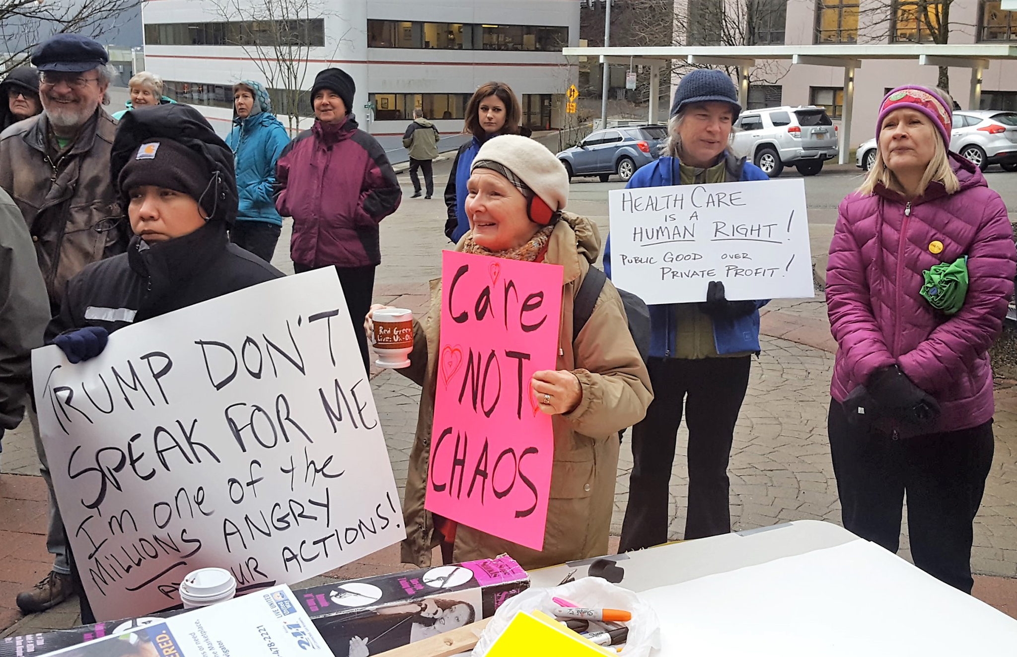 Protesters advocating for affordable healthcare rallied across the street from the Capitol Wednesday. (Liz Kellar | Juneau Empire)