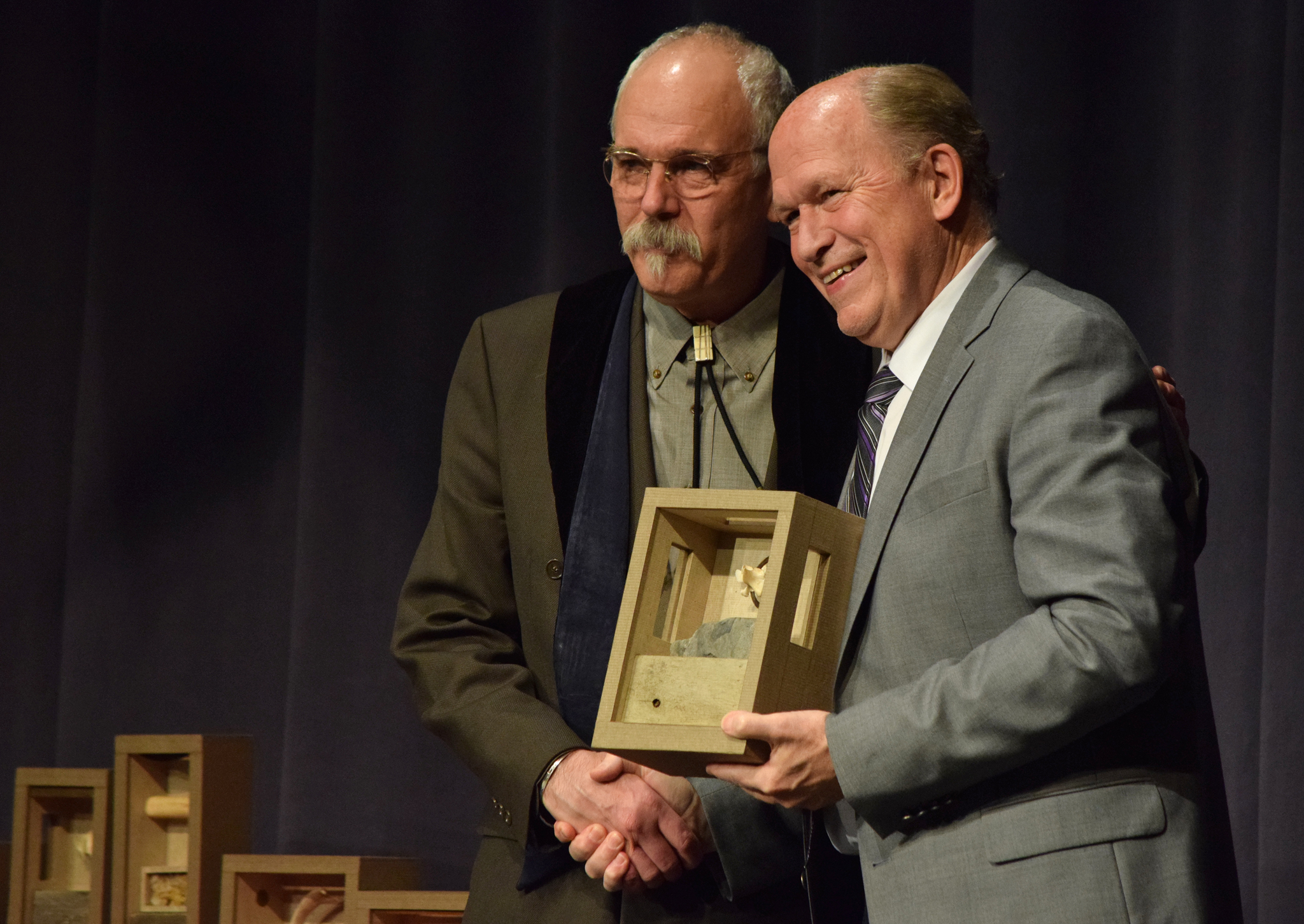 Bob Banghart of Juneau accepts a Distinguished Service to the Humanities award from Gov. Bill Walker on Thursday night 2017 at the Juneau Arts and Culture Center during the 2017 Governor’s Awards for the Arts and Humanities. (James Brooks | Juneau Empire)
