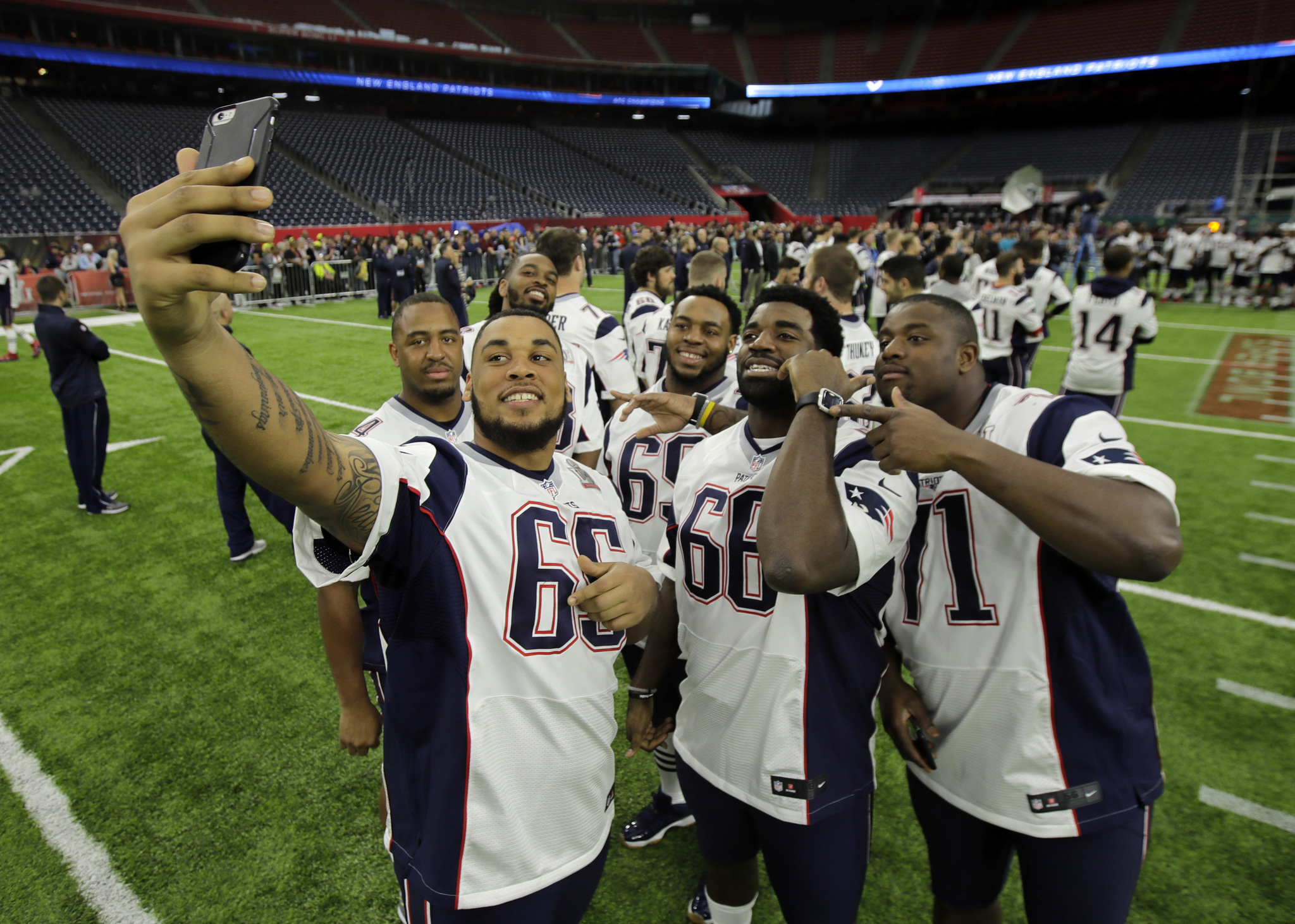 New England Patriots players take a selfie during a walk through at NRG Stadium, site of the NFL Super Bowl 51 football game Saturday in Houston. The Patriots will face the Atlanta Falcons in the Super Bowl Sunday. (AP Photo | Charlie Riedel)