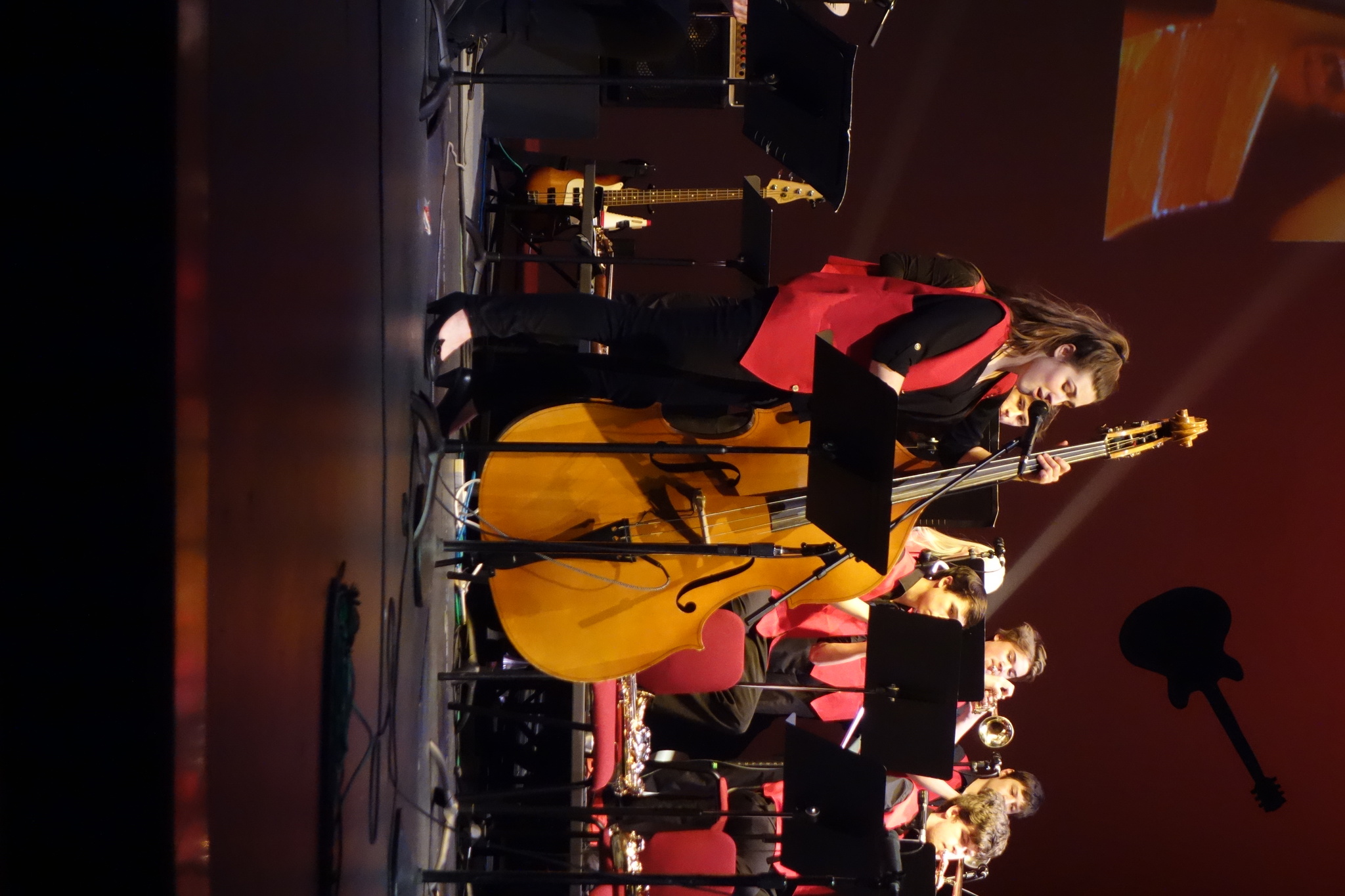 Juneau-Douglas High School students sings “Stormy Weather” as she plays the bass at the Sitka Jazz Festival (Clara Miller| Capital City Weekly).