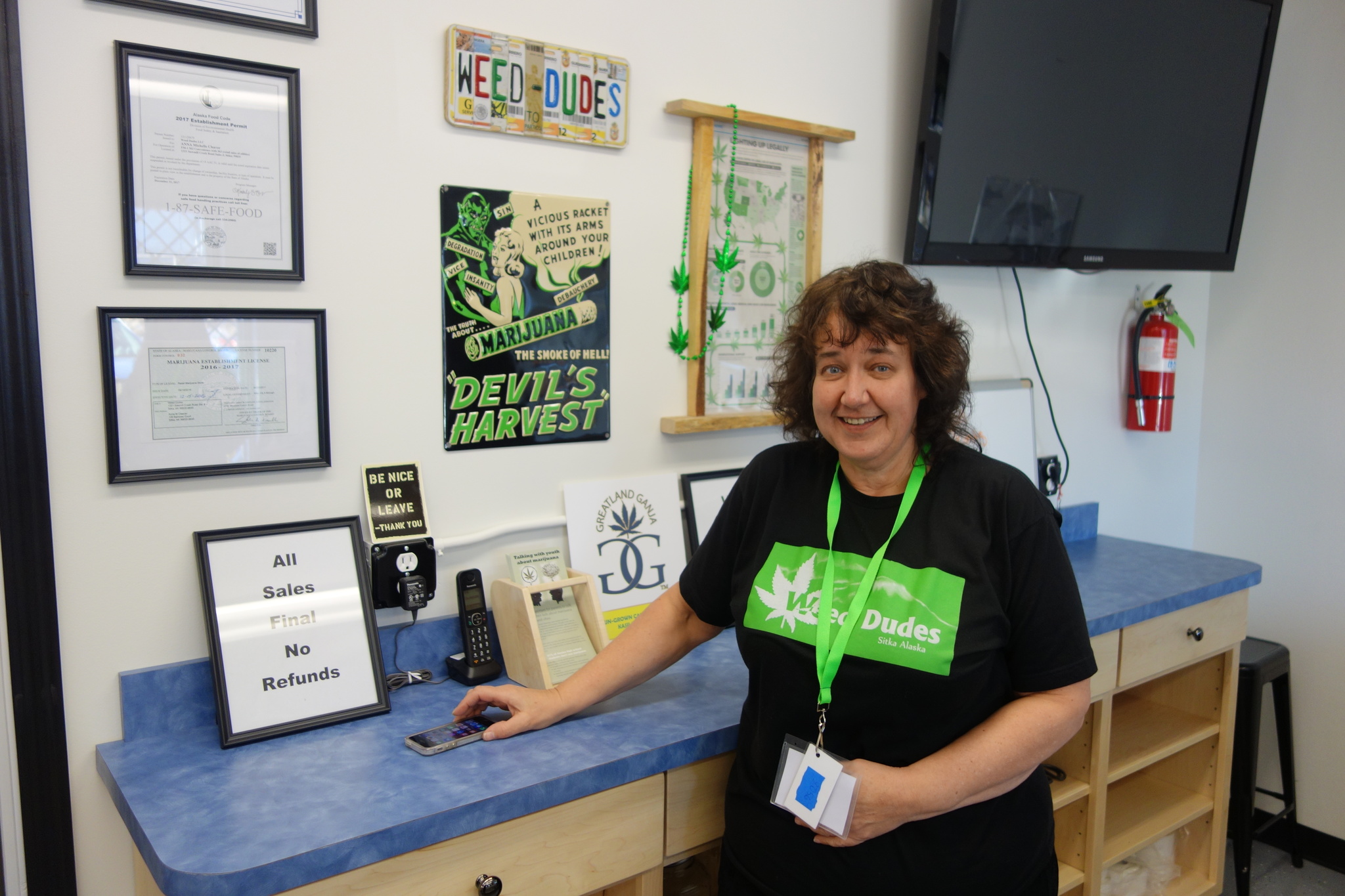 Michelle Cleaver stands behind the counter at Weed Dudes, the new pot shop in Sitka.