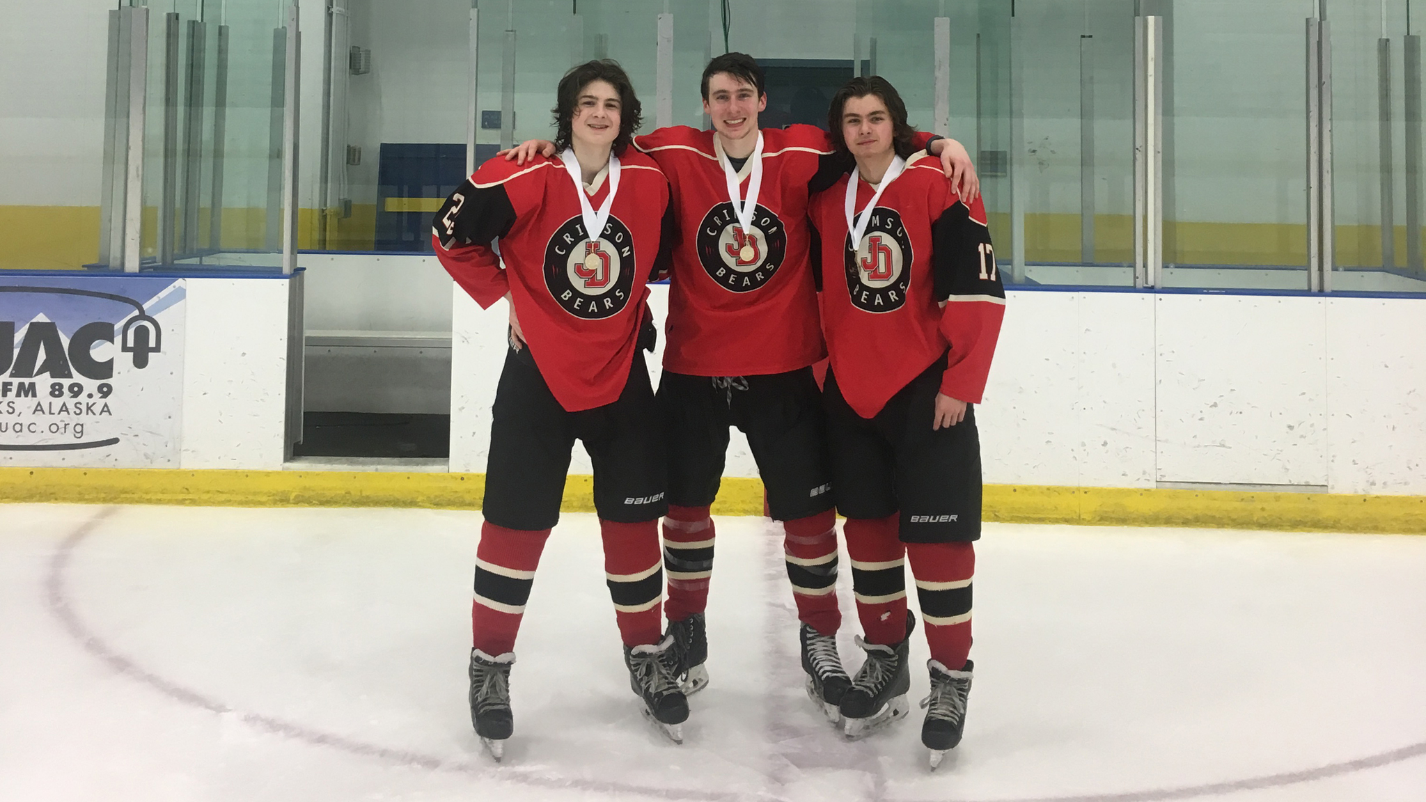 Left to right: Juneau-Douglas High School hockey’s Cameron Smith, Quin Gist and Billy Bosse pose together after being named to the all-conference tournament team Saturday in Fairbanks’ Patty Center Ice Arena. (Courtesy photo)