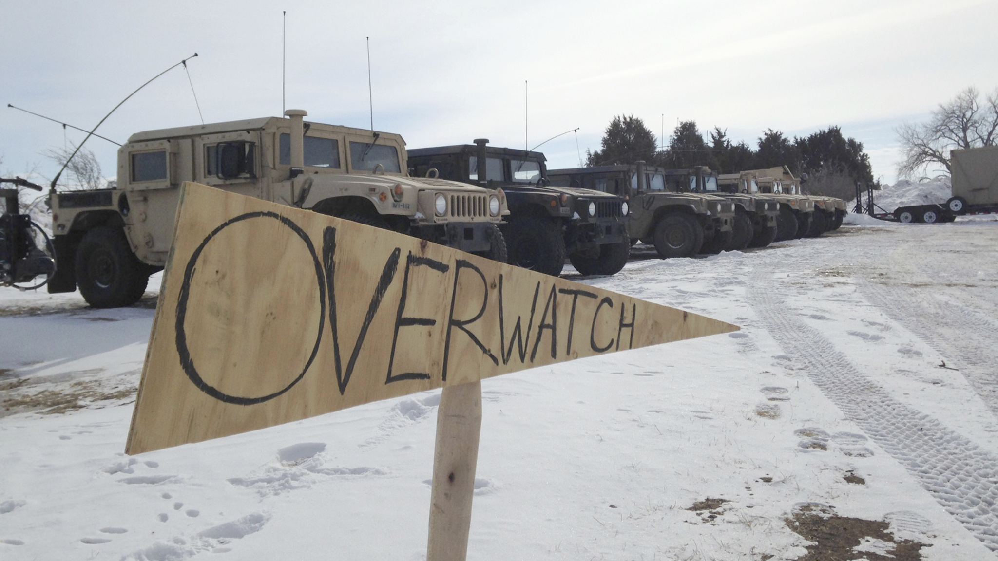 Military vehicles are staged near the path of the Dakota Access pipeline Thursday, Feb. 9, 2017 near Cannon Ball, North Dakota. The developer says construction of the Dakota Access pipeline under a North Dakota reservoir has begun and that the full pipeline should be operational within three months. One of two tribes who say the pipeline threatens their water supply on Thursday filed a legal challenge asking a court to block construction while an earlier lawsuit against the pipeline proceeds. (James MacPherson | The Associated Press)