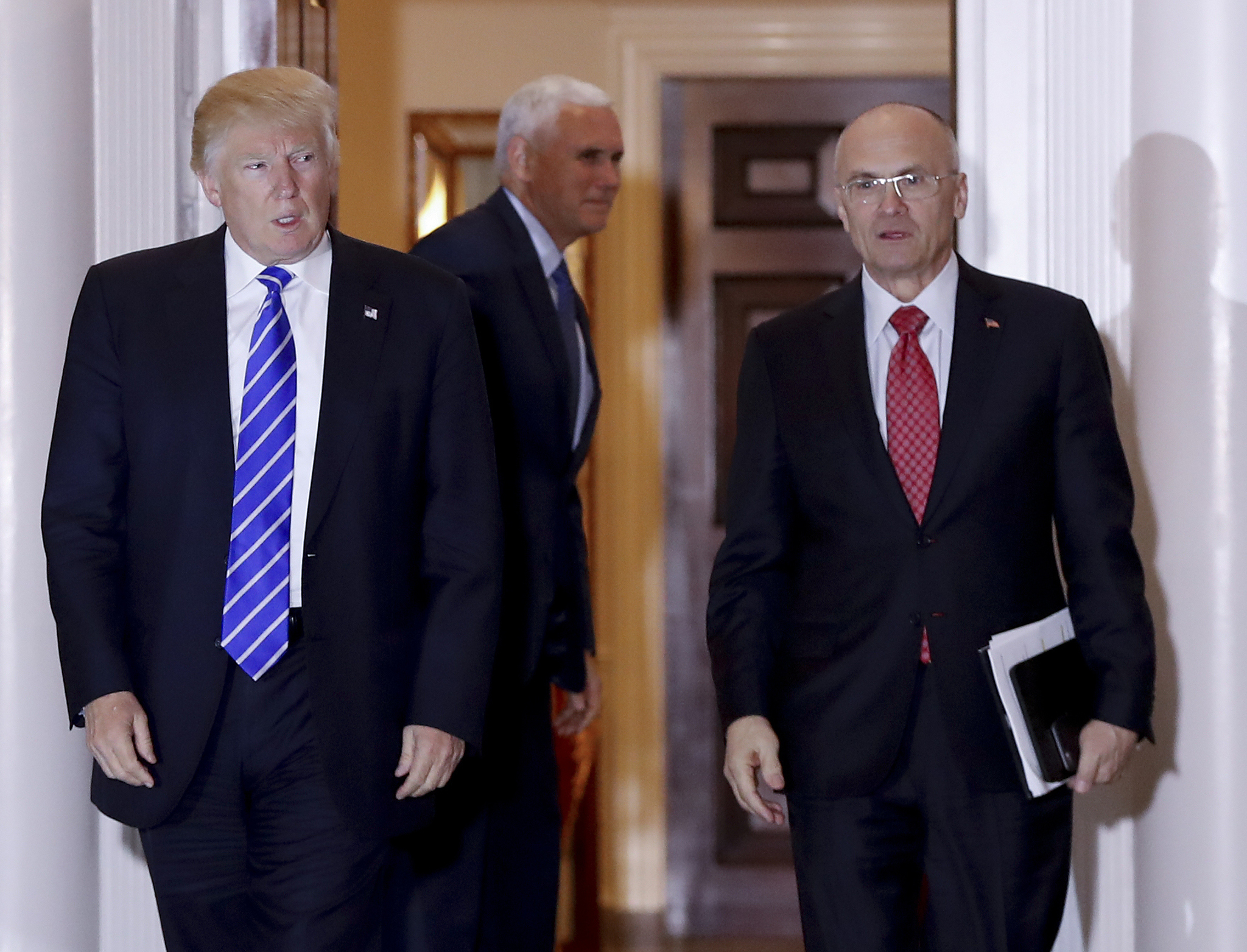 In this Nov. 19, 2016 file photo, then-President-elect Donald Trump walks Labor Secretary-designate Andy Puzder from Trump National Golf Club Bedminster clubhouse in Bedminster, New Jersey. Puzder’s nomination appeared to be in serious trouble Wednesday, Feb. 15, 2017, as Republicans said they were concerned over his failure to pay taxes for five years on a former housekeeper who wasn’t authorized to work in the U.S. (Carolyn Kaster | The Associated Press file)