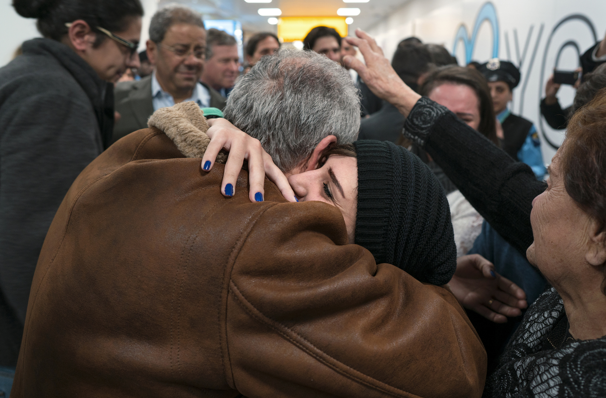 In a Monday, Feb. 6, 2017 photo, family members who have just arrived from Syria embrace and are greeted by family who live in the United States upon their arrival at John F. Kennedy International Airport in New York. Organizers in cities across the U.S. are telling immigrants to miss class, miss work and not shop on Thursday, Feb. 16, 2017, as a way to show the country how important they are to America’s economy and way of life. “A Day Without Immigrants” actions are planned in cities including Philadelphia, Washington, Boston and Austin, Texas. (Craig Ruttle | The Associated Press)