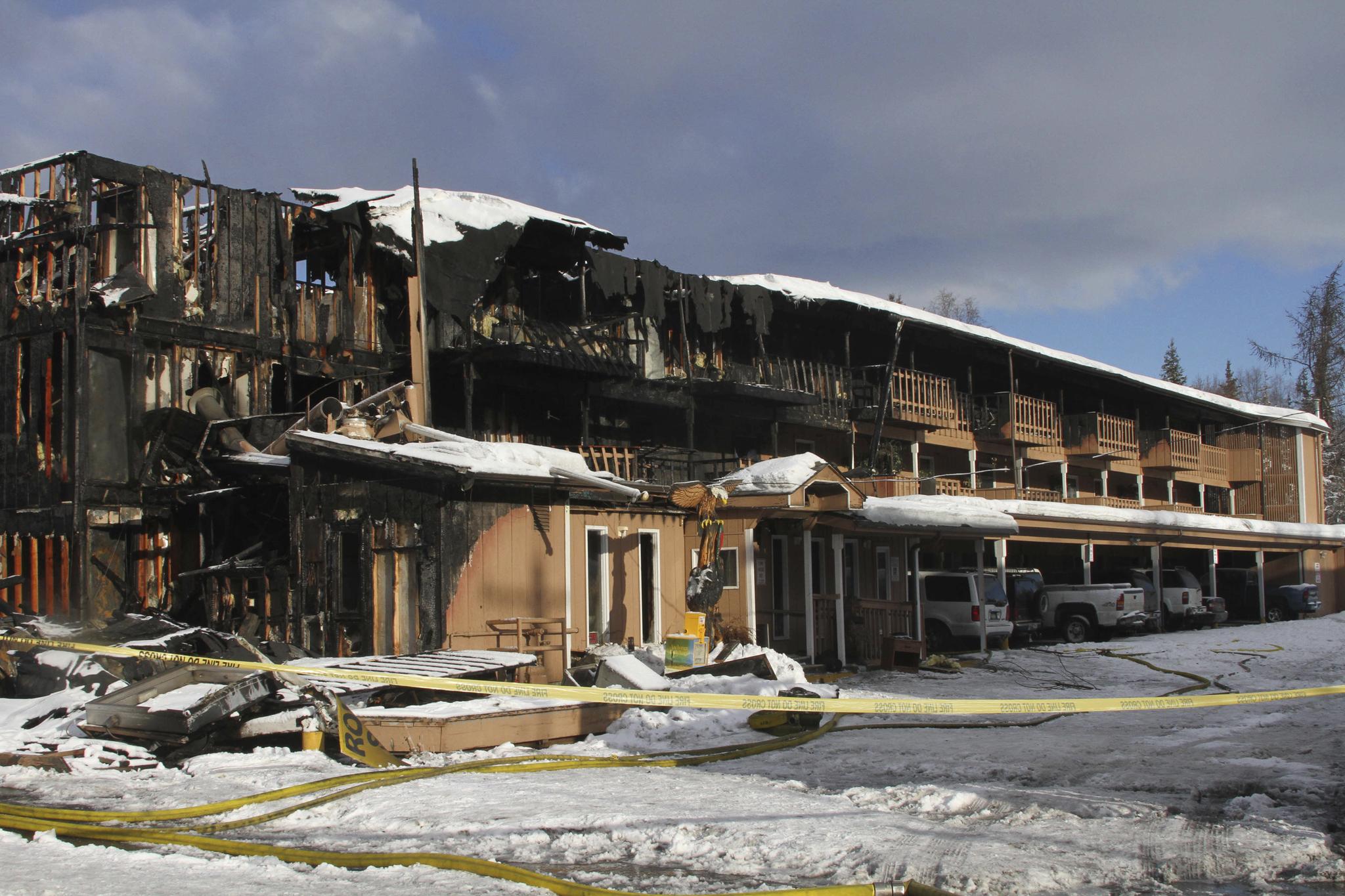 The burned remains of the Royal Suite Lodge in Anchorage are shown Wednesday after an early morning fire. Officials said several were injured in the deadly fire. The fire&rsquo;s cause is under investigation. (Mark Thiessen | The Associated Press)