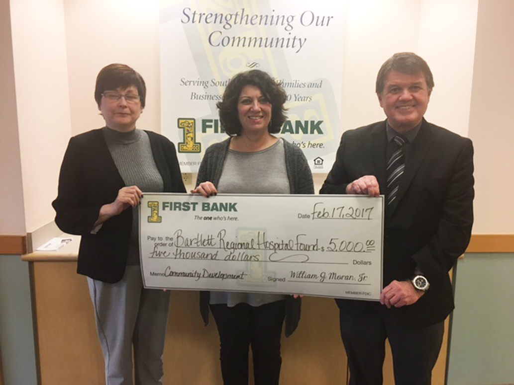 Bartlett Regional Hospital Foundation Executive Director Maria Uchytil, center, accepts a check from First Bank&rsquo;s Vice President Bob Anderson and Sheila Kleinschmidt, First Bank&rsquo;s Community Development Officer. (Courtesy photo)