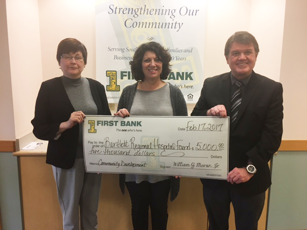 Bartlett Regional Hospital Foundation Executive Director Maria Uchytil, center, accepts a check from First Bank’s Vice President Bob Anderson and Sheila Kleinschmidt, First Bank’s Community Development Officer. (Courtesy photo)