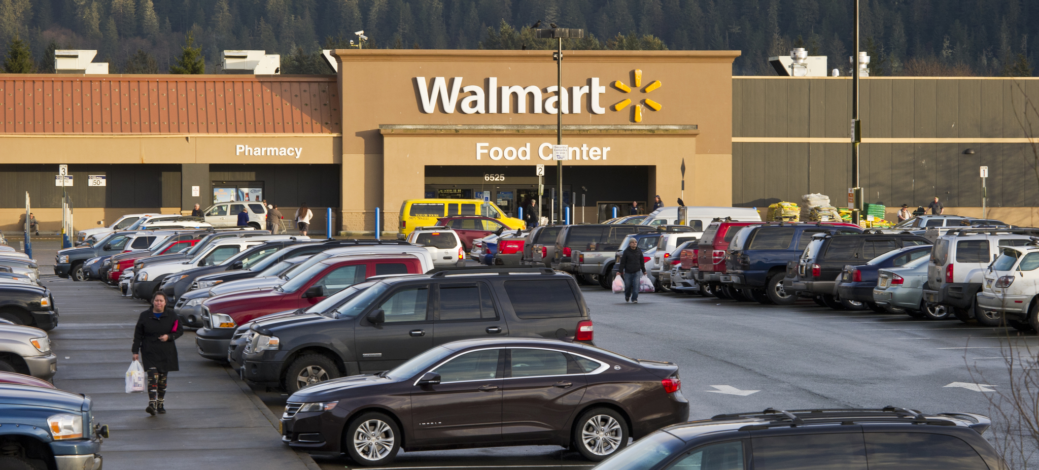 In this file photo from January 2016, vehicles fill the Juneau Walmart parking lot on the first day of its going out of business sale. Juneau’s Walmart, which has been open since 2007, was among 154 stores in the U.S. being “pruned” from the corporate tree, according to Walmart spokesperson Delia Garcia. About 180 Juneau residents lost their jobs. (Michael Penn | Juneau Empire File)