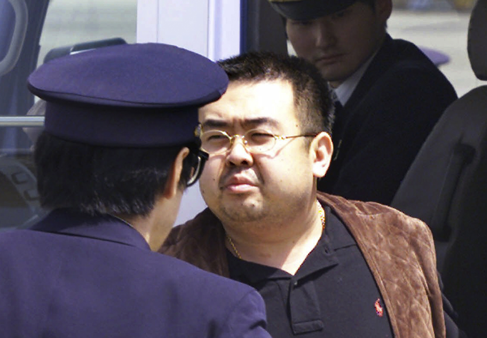 This May 4, 2001 photo shows Kim Jong Nam, exiled half brother of North Korea’s leader Kim Jong Un, escorted by Japanese police officers at the airport in Narita, Japan. Kim was caught with his family trying to enter Japan using a fake passport. He told Japanese officials they were going to Disneyland and was quickly expelled, a major embarrassment for Kim Jong Il that seemingly ended any chance he could succeed his father. (Itsuo Inouye | The Associated Press File)