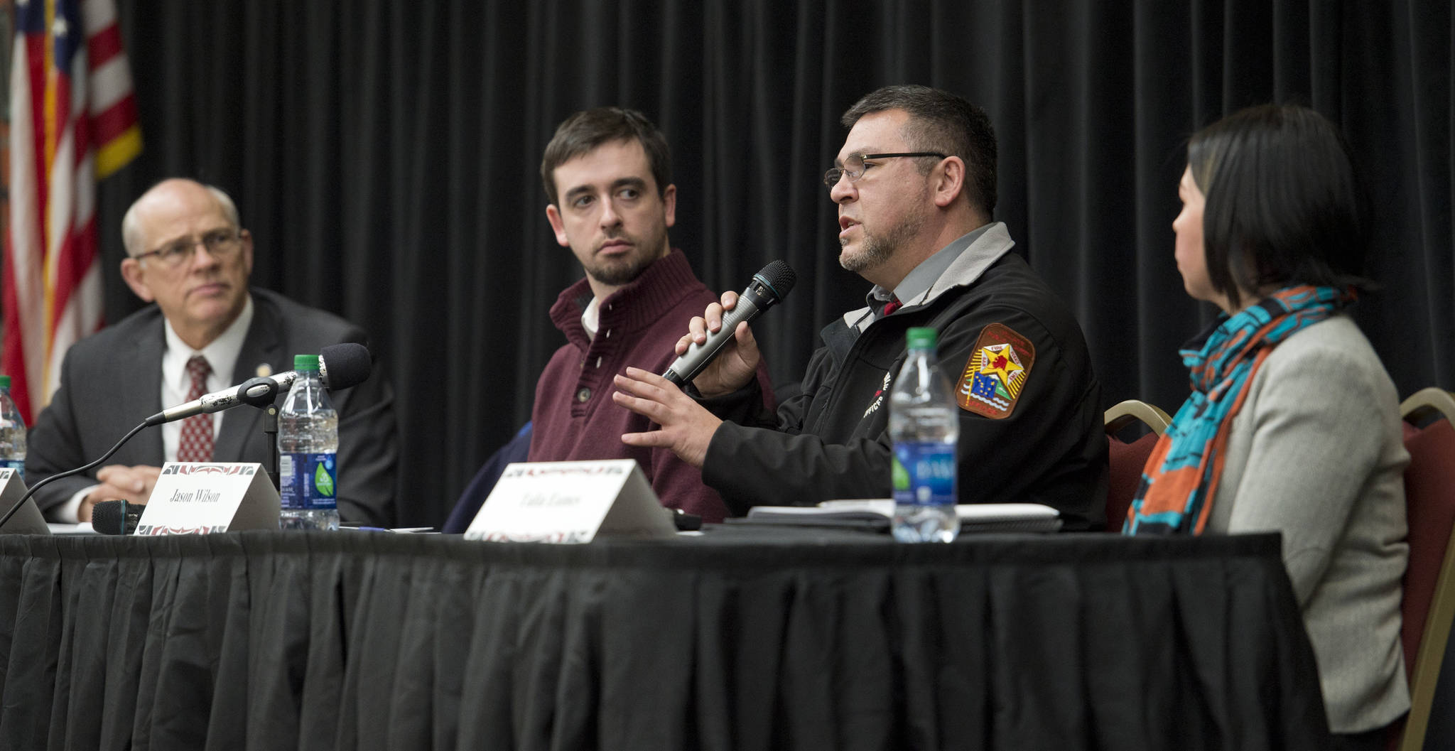 Central Council of the Tlingit and Haida Indian Tribes of Alaska Public Safety Manager Jason Wilson, second from right, speaks about criminal justice reform during the Native Issues Forum at the Elizabeth Peratrovich Hall on Thursday. As speaking at the forum are Sen. John Coghill (SB 91 Bill sponsor), left, Jordan Shilling, legislative staff member to Sen. Coghill, and Talia Eames, program coordinator for Central Council’s Second Chance Reentry program and chair to Juneau Reentry Coalition’s Alaska Native Community Working Group. (Michael Penn | Juneau Empire)