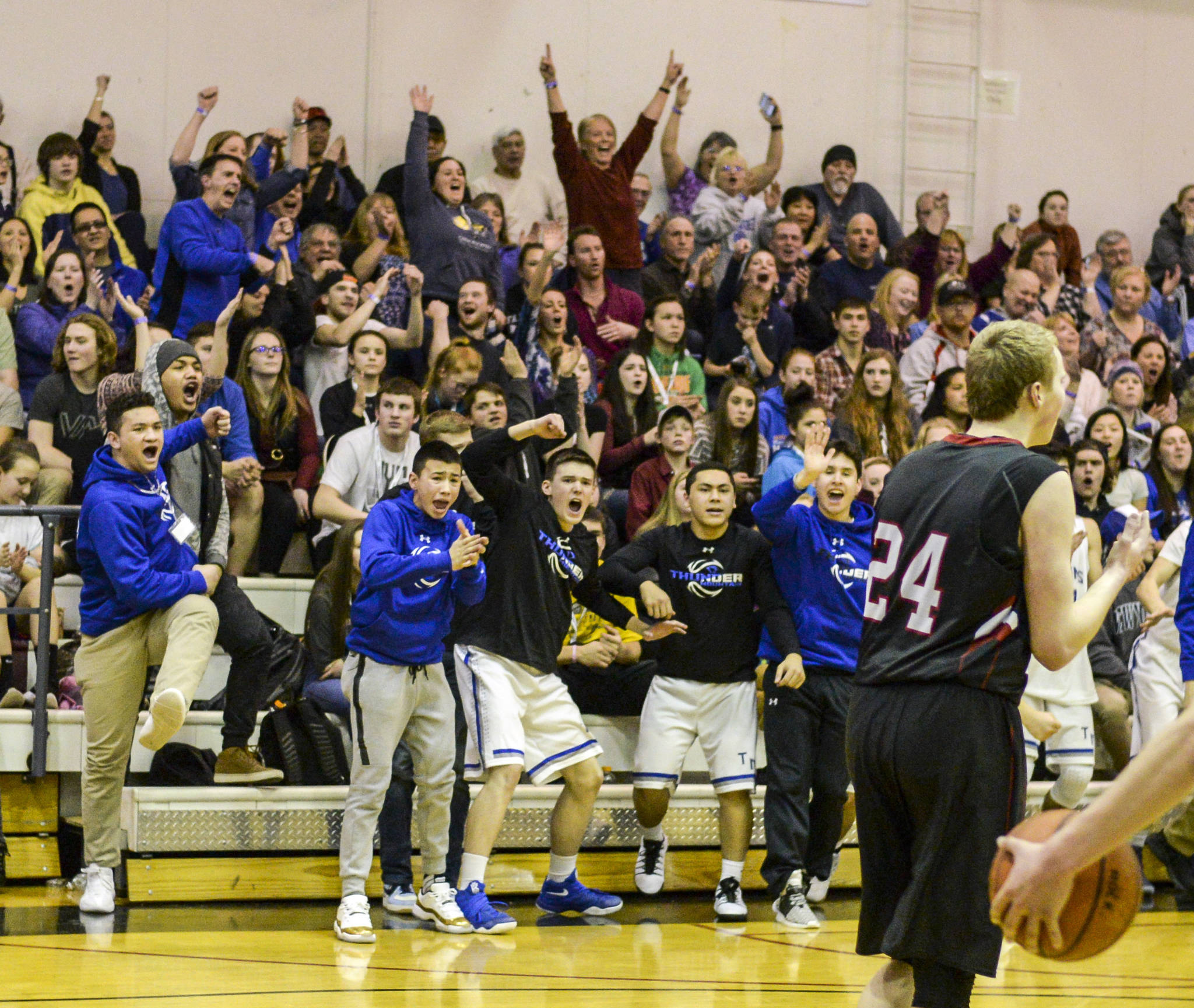 Thunder Mountain fans celebrate after a basket Tuesday during the Falcons 56-40 win against Juneau-Douglas during the first round of the Region V 4A tournament in the Juneau-Douglas gym in Juneau. (Taylor Balkom | Ketchikan Daily News)