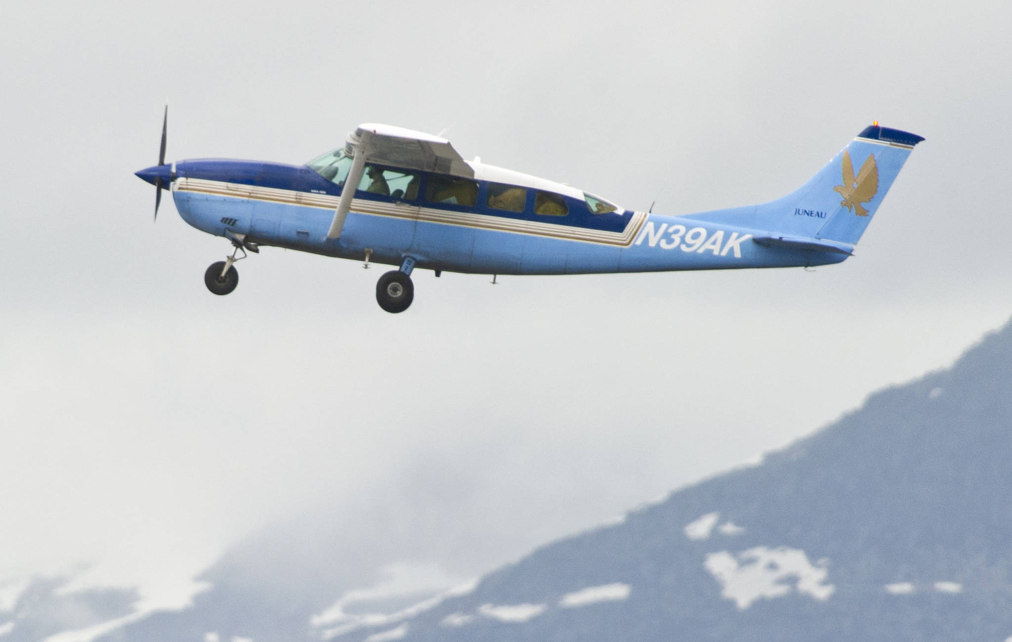 A Wings of Alaska plane takes off from the Juneau International Airport on July 18, 2015. (Michael Penn | Juneau Empire)