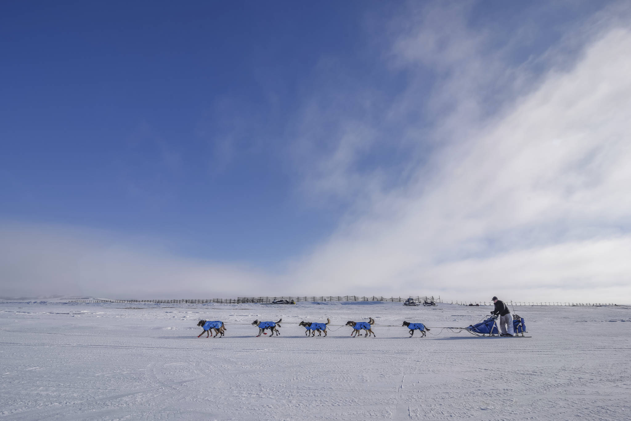 In this Monday photo, veteran musher Scott Smith and his race team travel along the frozen Kouwegok River out of Unalakleet toward the Shaktoolik checkpoint. (Mike Kenney | Iditarod Trail Committee)