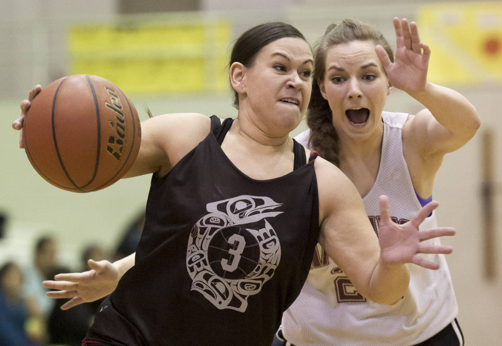 Criag’s Molly Sharp, left, drives to the basket against Haines’ Samantha Clay during their Womens bracket game in the 2016 Juneau Lions Club 70th Gold Medal Basketball Tournament at Juneau-Douglas High School. Craig won 59-45. (Michael Penn | Juneau Empire File)
