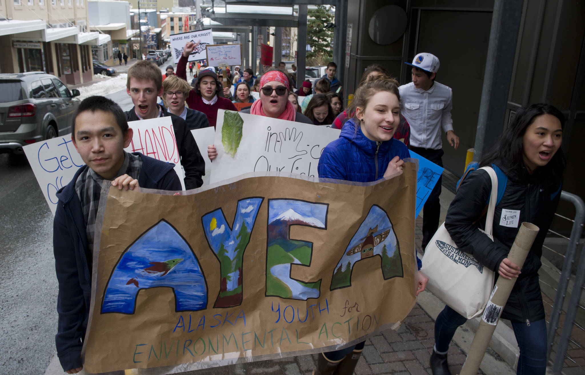 Nineteen high school teens from across the state, from Utqiagvik to Ketchikan, hold a March for Salmon as the culmination of this year’s Civics and Conservation Summit in Juneau, on Friday, March 17, 2017. The event is hosted by Alaska Youth for Environmental Action, a program of The Alaska Center in Anchorage, which trains young people to be environmental leaders. (Michael Penn | Juneau Empire)
