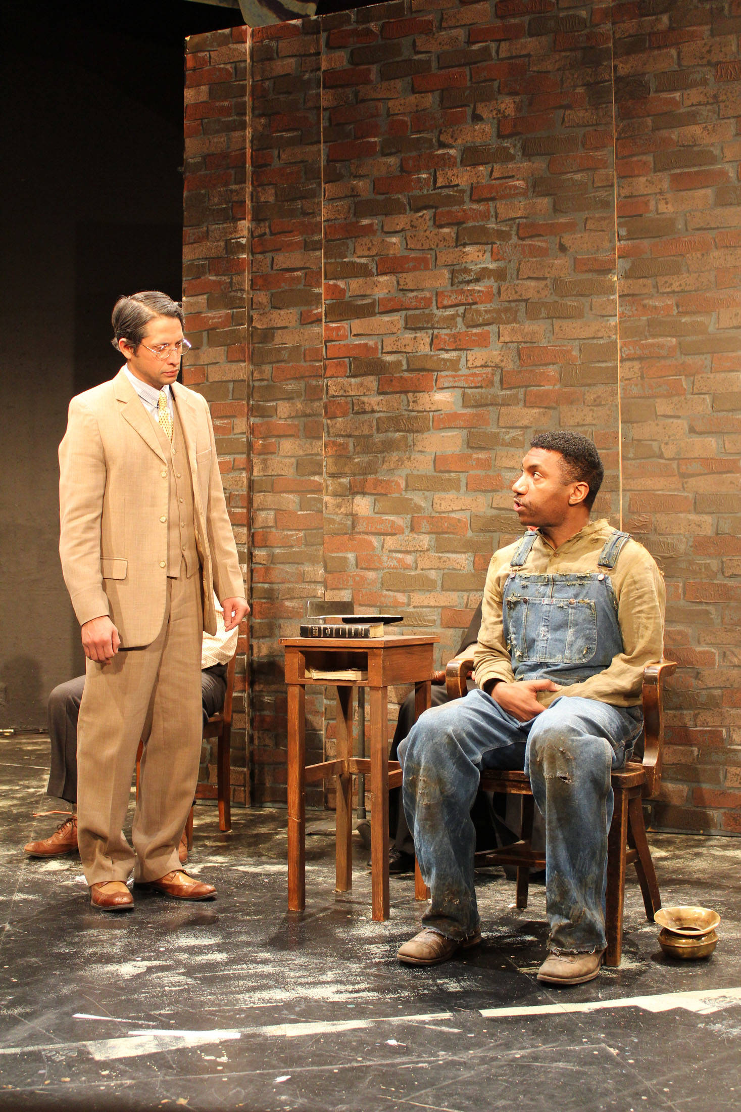 Atticus puts Tom Robinson on the witness stand. Left is Enrique Bravo (Atticus Finch). Right is Keith McCoy (Tom Robinson). Photo by Julie Coppens.