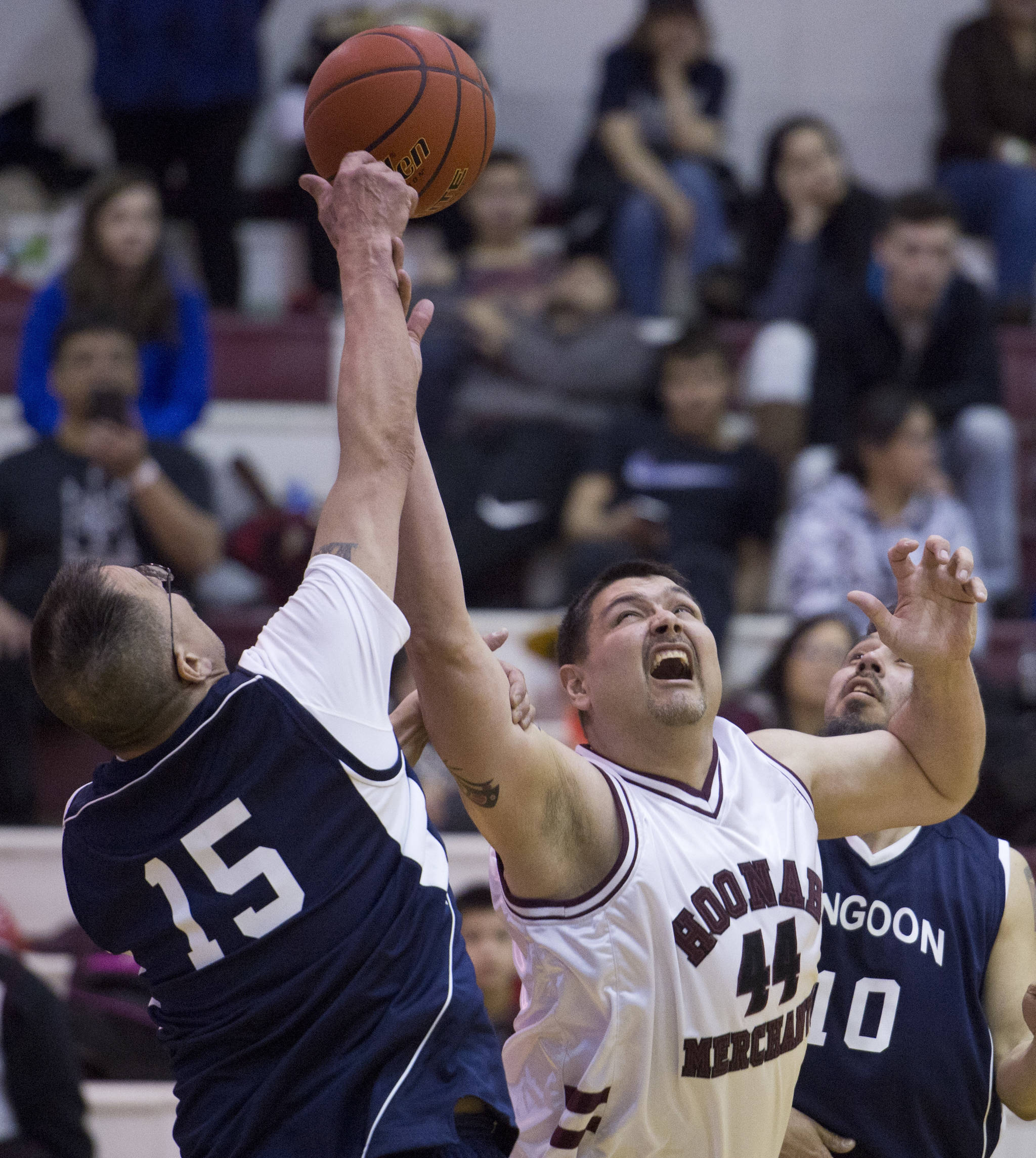 Angoon’s Randy Gamble, left, and Hoonah’s Mike Miles compete for a rebound in their Masters Bracket game in the Lions Club’s Gold Medal Basketball Tournament at Juneau-Douglas High School on Thursday. (Michael Penn | Juneau Empire)