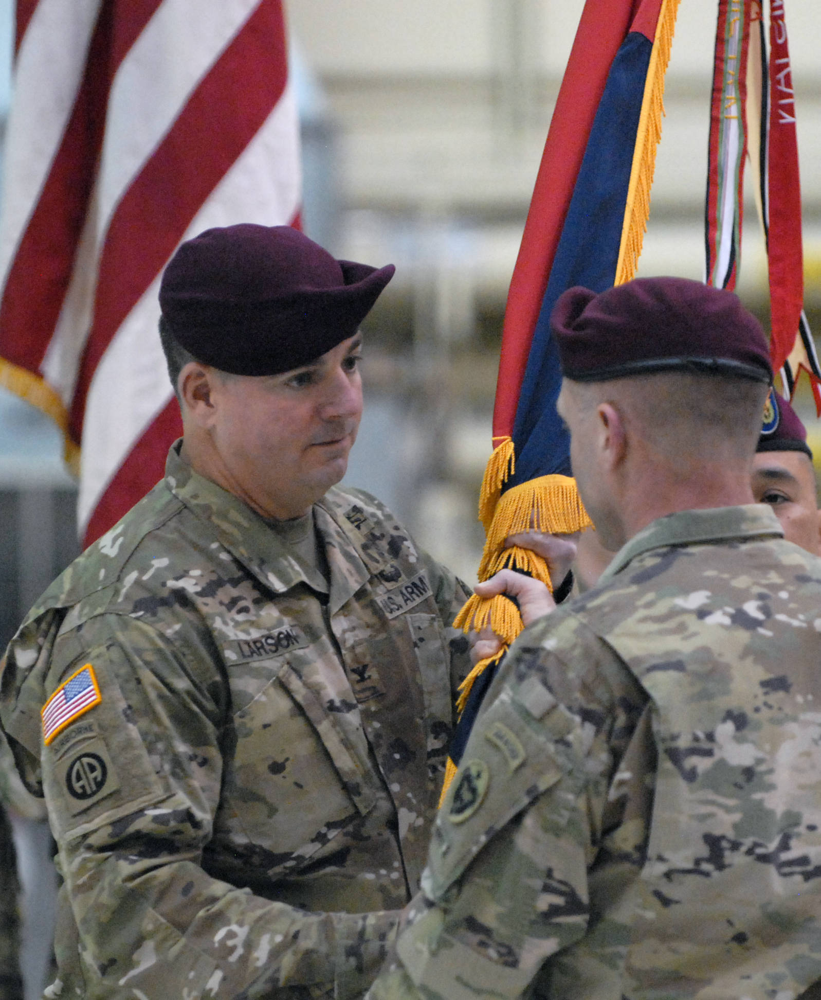 Col. Paul Larson, left, takes the colors from Maj. Gen. Bryan Owens, Commanding General of U.S. Army Alaska, during a change of command ceremony for the Army’s 4th Brigade Combat Team (Airborne), 25th Infantry Division on Friday, March 24, 2017 on Joint Base Elmendorf Richardson. During the ceremony, Col. Paul Larson took command from Col. Scott Green, who had led the brigade since 2014. (Star photo by Matt Tunseth)