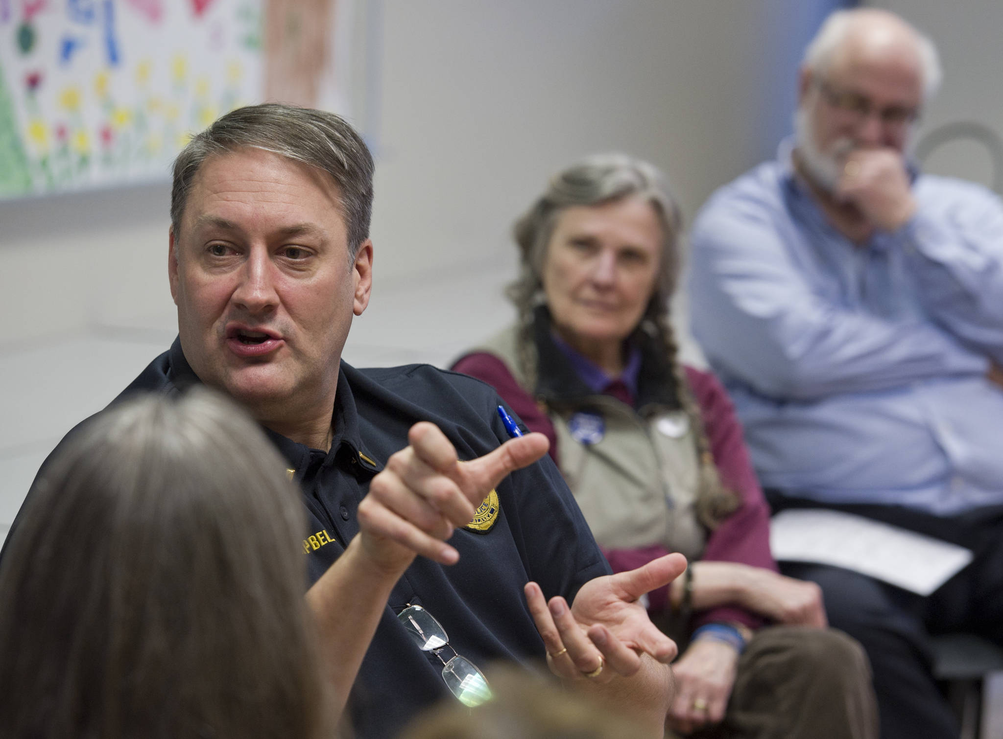 Juneau Police Department Lt. David Campbell speaks about residential safety and rising crime rates during a Douglas Island Neighbors Association meeting at the Douglas Public Library on Tuesday. (Michael Penn | Juneau Empire)