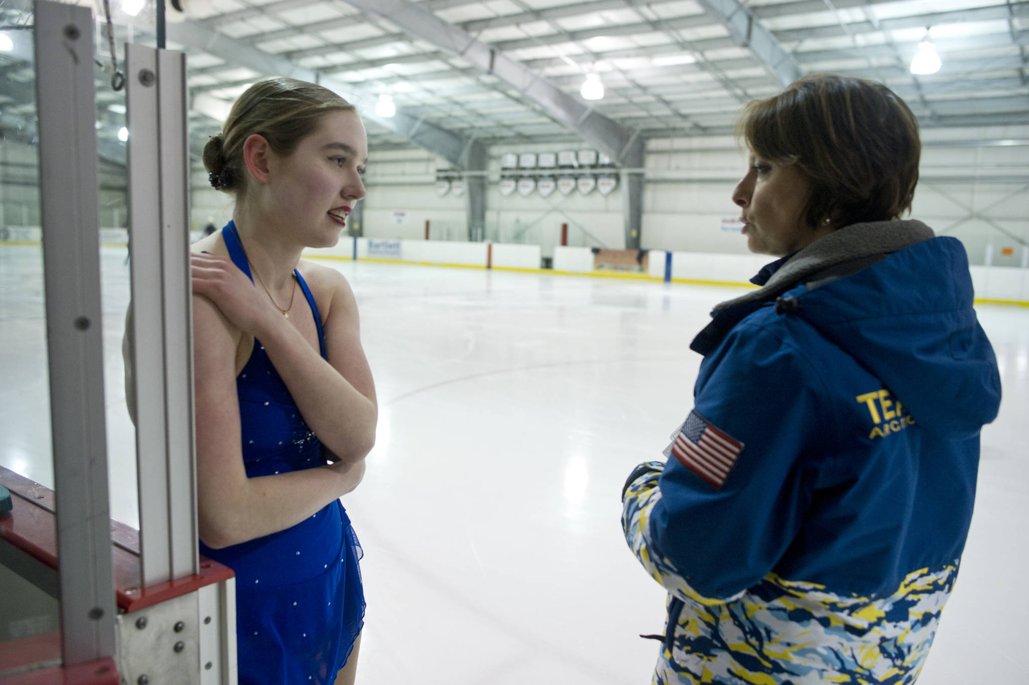 Laurie Balstad, a member of the Juneau Skating Club, speaks with her coach, Pam Leary, during practice at Treadwell Arena on Friday, March 3, 2017. (Michael Penn | Juneau Empire)