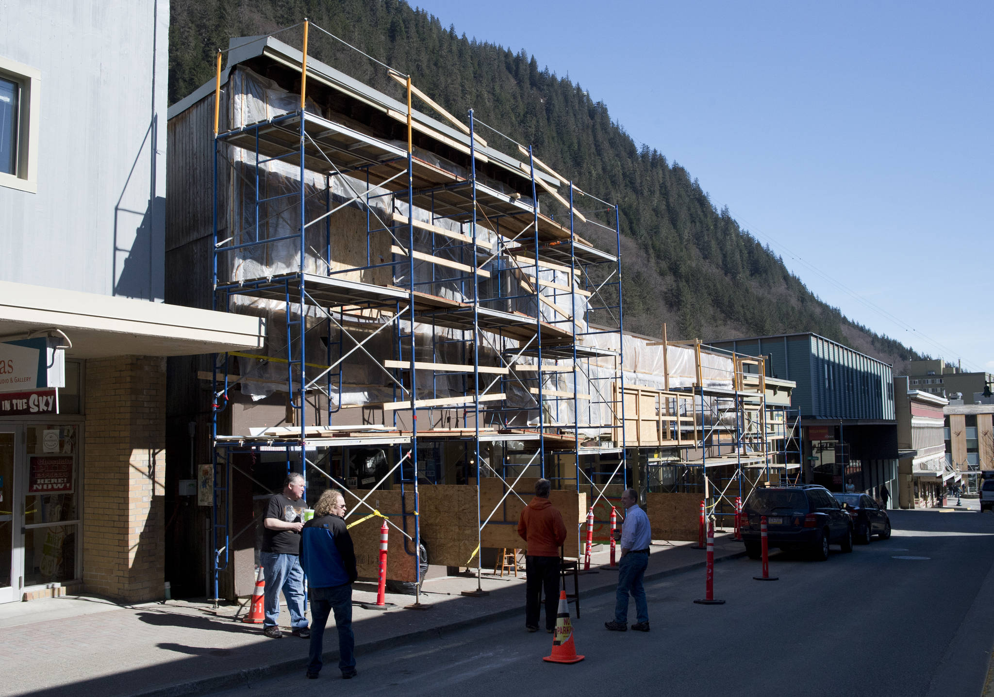 MICHAEL PENN | JUNEAU EMPIRE A fire started on the outside wall Saturday evening caused about $30,000 damage to a Seward Street building that includes Art Sutch Photography shop.