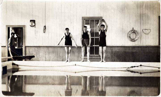 Three men get ready to dive into the pool at the Treadwell Natatorium in this undated photo. (Alaska State Library Historical Collection, ASL-P525-6-21)