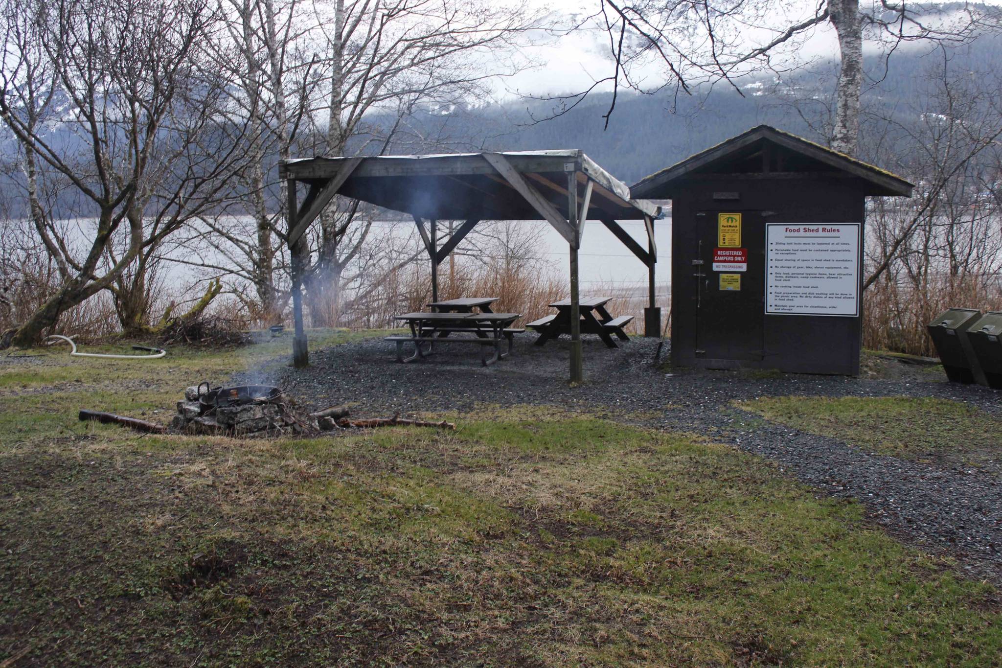 Thane Campground sat empty, save for a small fire, on its first day of operation Saturday. The city is hoping that the campground serves as a spot for homeless to stay. Alex McCarthy | Juneau Empire