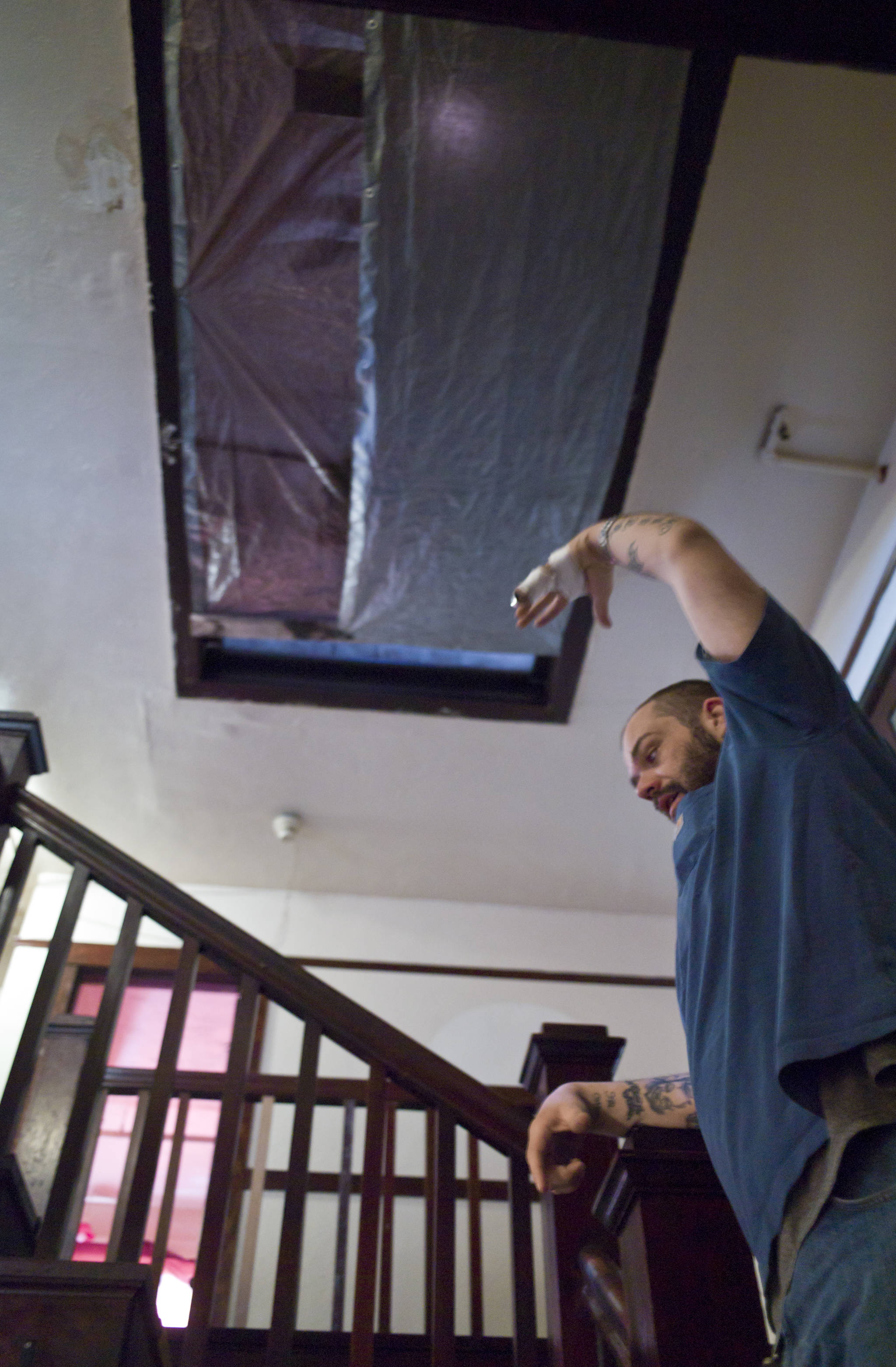 Rick Cotten talks about work done to close up the leaking skylight on Friday, May 5, 2017, before the Bergmann Hotel can reopen. The city closed the hotel on health and safety concerns in March. (Michael Penn | Juneau Empire)