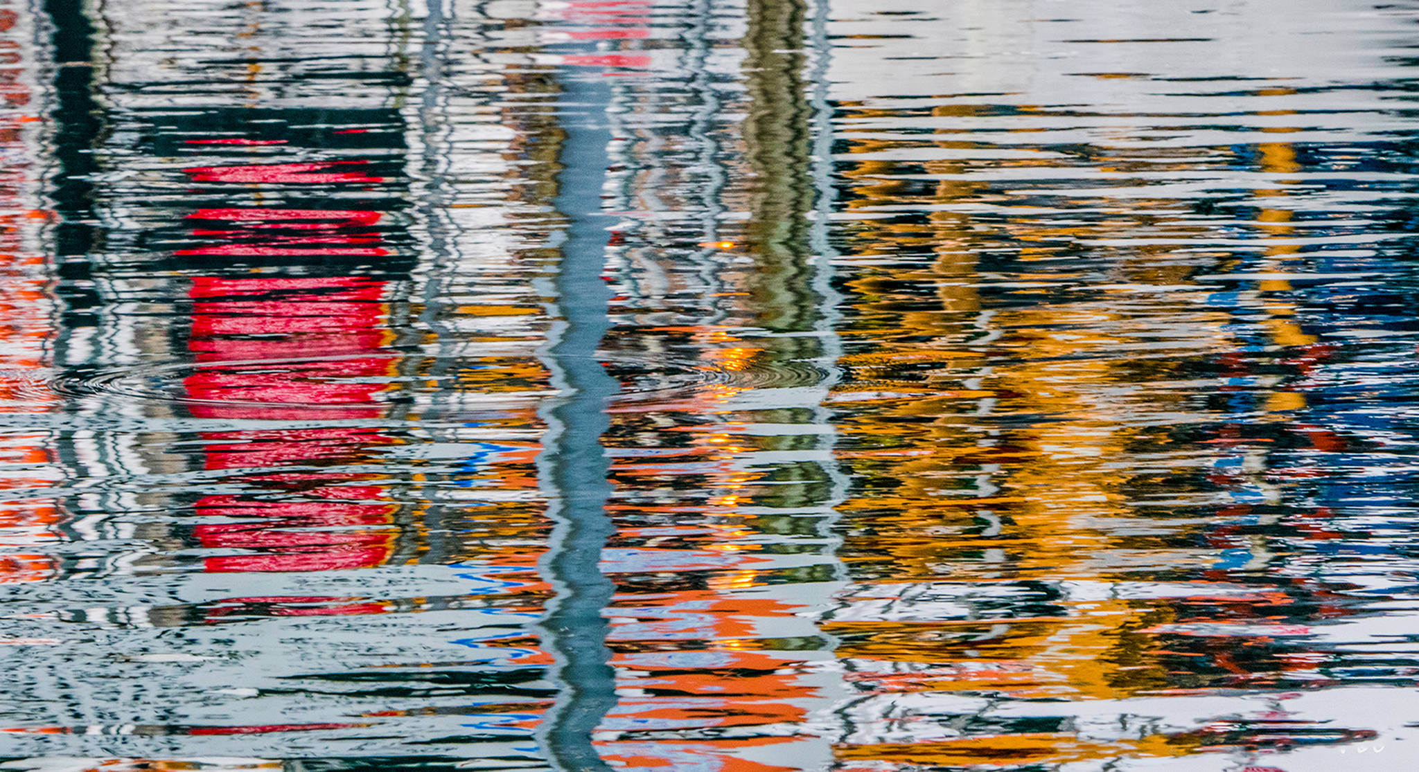 Colorful harbor reflections. Photo by Kerry Howard.