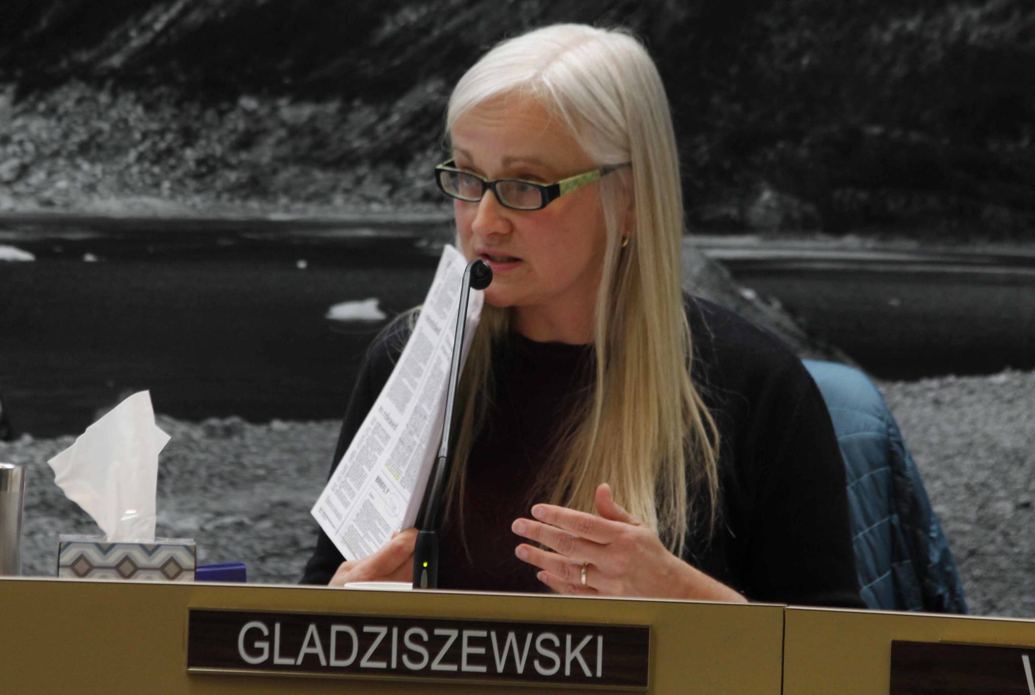 Assembly member Maria Gladziszewski refers to issues of the Empire from 1989, illustrating the long process of amending the city’s mining ordinance. The mining ordinance is back under discussion after a proposal written by five businessmen. (Alex McCarthy | Juneau Empire)