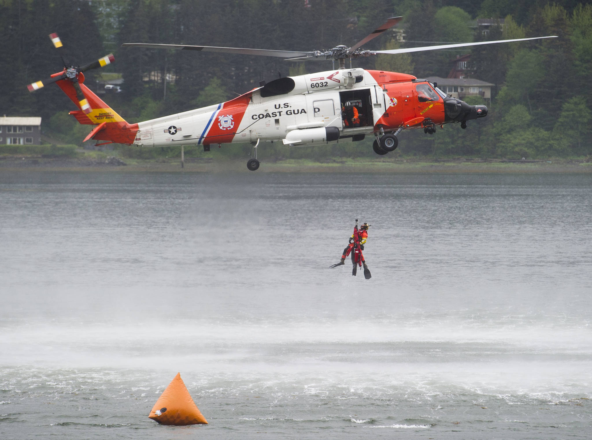 A rescue crew from Station Sitka demonstrate their skills in the harbor during the Juneau Maritime Festival at Marine Park in Juneau on Saturday, May 7, 2016. (Michael Penn | Juneau Empire File)