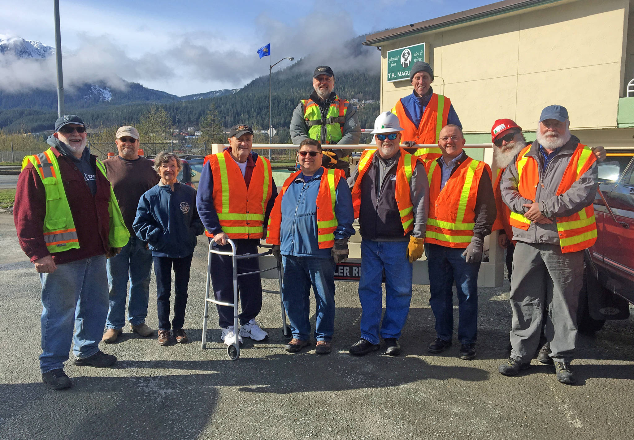 Friends of the Flags volunteers who were instrumental in the raising of the state flags along Egan Drive on Saturday, April 29. Front row, left to right: Eric Peter, Tom Gill, Judy Ripley, Jim Carroll, Mike Baxter, Bruce Botelho, Dan Kenkel, John Peterson, Charles Payee. Back row: George Fisher, Don Beard. Not pictured: Brad Waldron and Chad Cameron. (Photo by Denise Carroll)