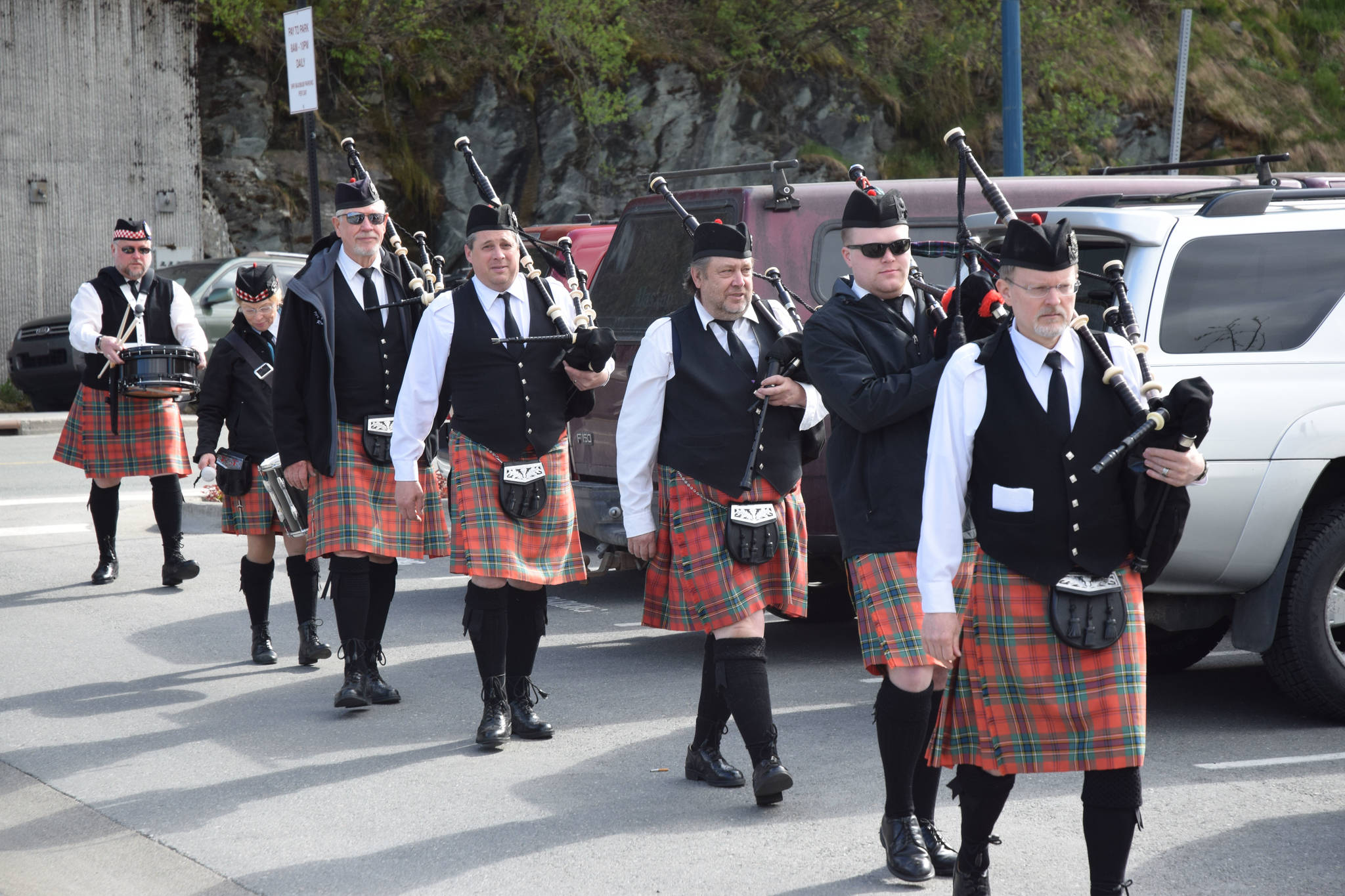 The City of Juneau Pipe Band arrive at the Blessing of the Fleet on Saturday, May 6, at the Commercial Fishermen’s Memorial. (Kevin Gullufsen | Juneau Empire)