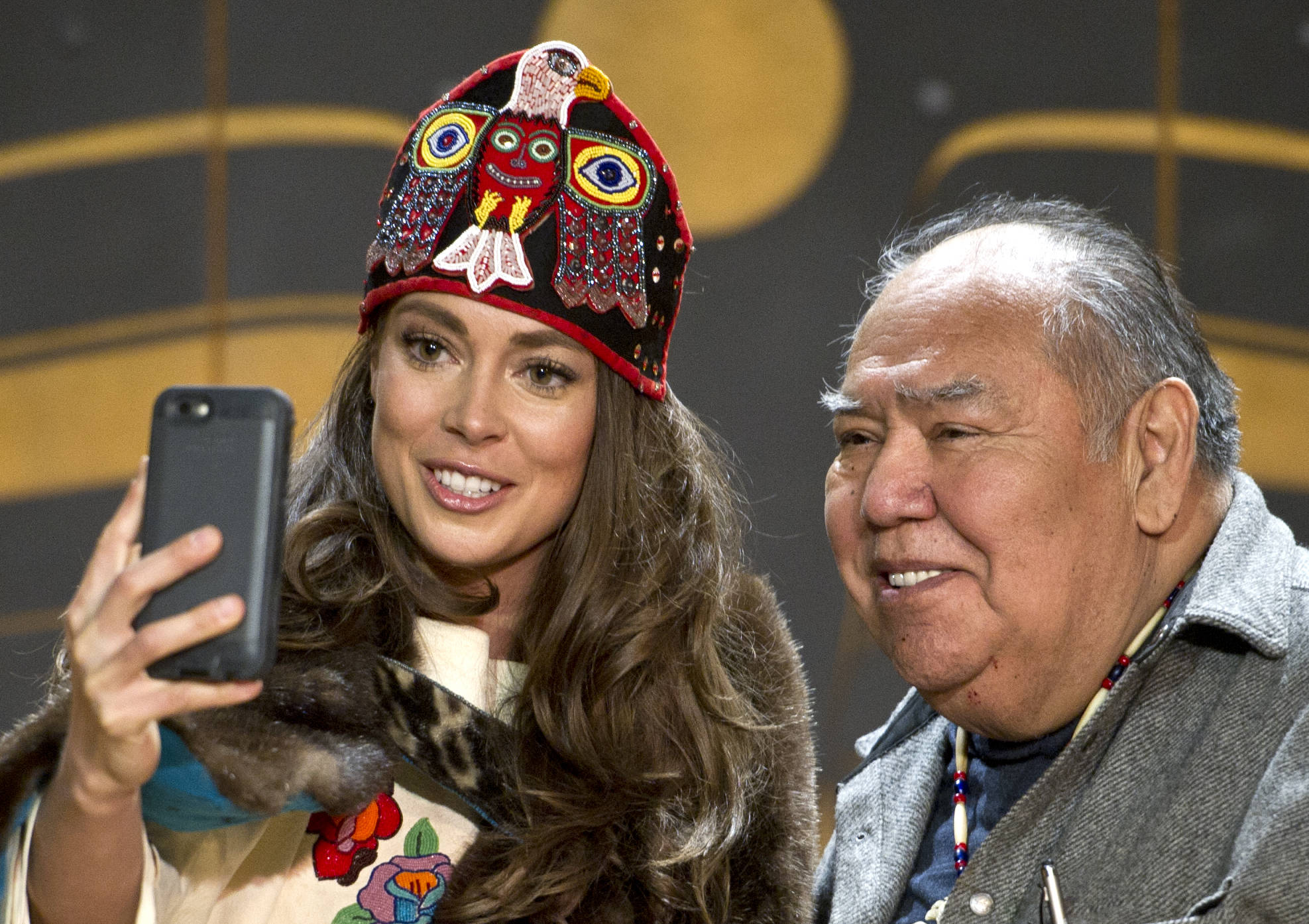 Miss Alaska USA 2017 Alyssa London takes a selfie with elder David Katzeek at the Walter Soboleff Center’s Clan House on Feb. 17, 2017. (Michael Penn | Juneau Empire file)