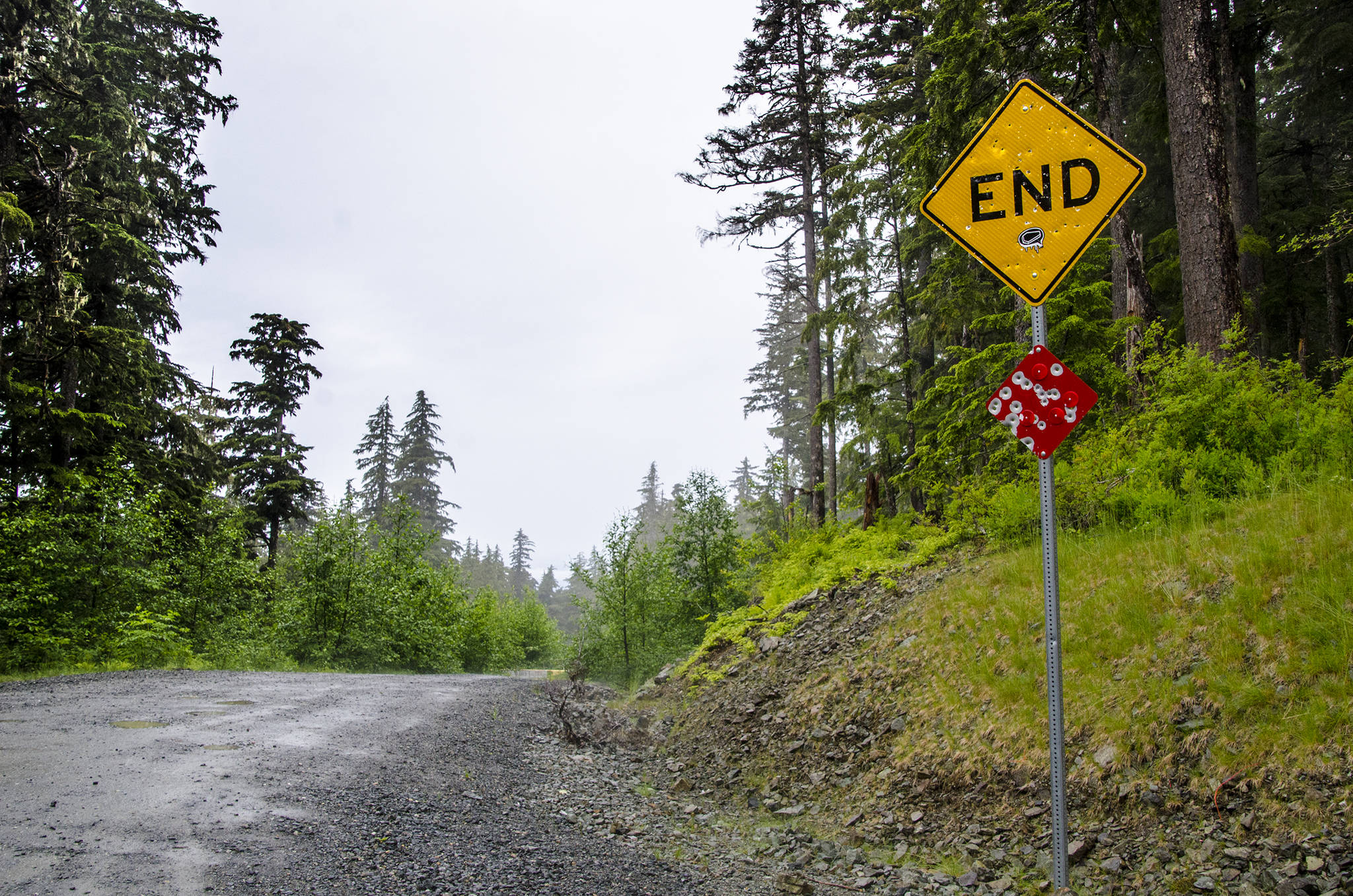 A sign sits at the end of the Juneau road in June 2014. (Marlena Sloss | Juneau Empire File)