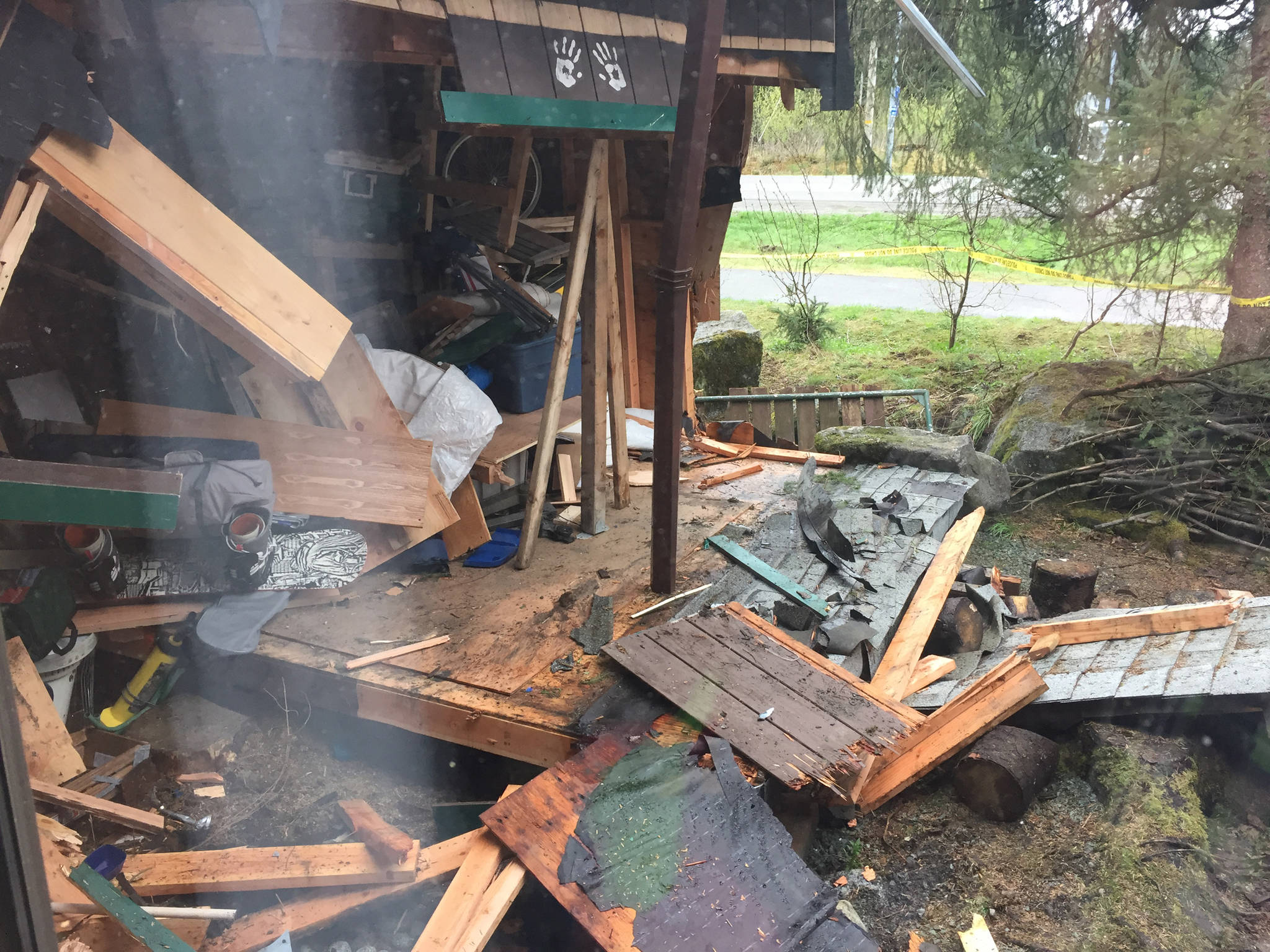 A shed is destroyed outside a Mendenhall Loop home that was hit by a drunk driver on Friday evening. (Kevin Gullufsen | Juneau Empire)