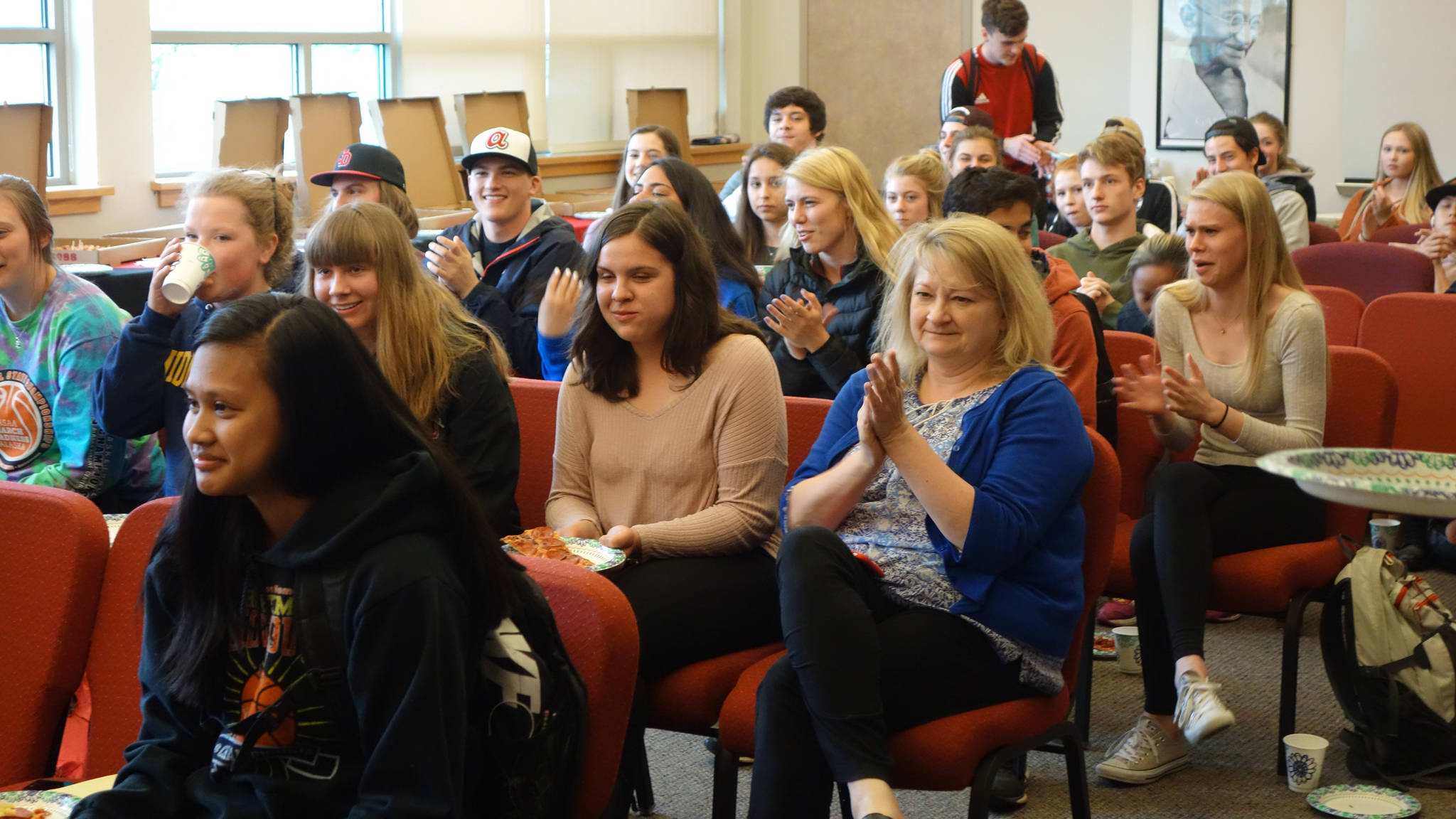 Students and faculty gather for Juneau-Douglas High School math teacher Lexie Razor’s BP Teacher of Excellence award ceremony at JDHS, Thursday, May 18. (Nolin Ainsworth | Juneau Empire)