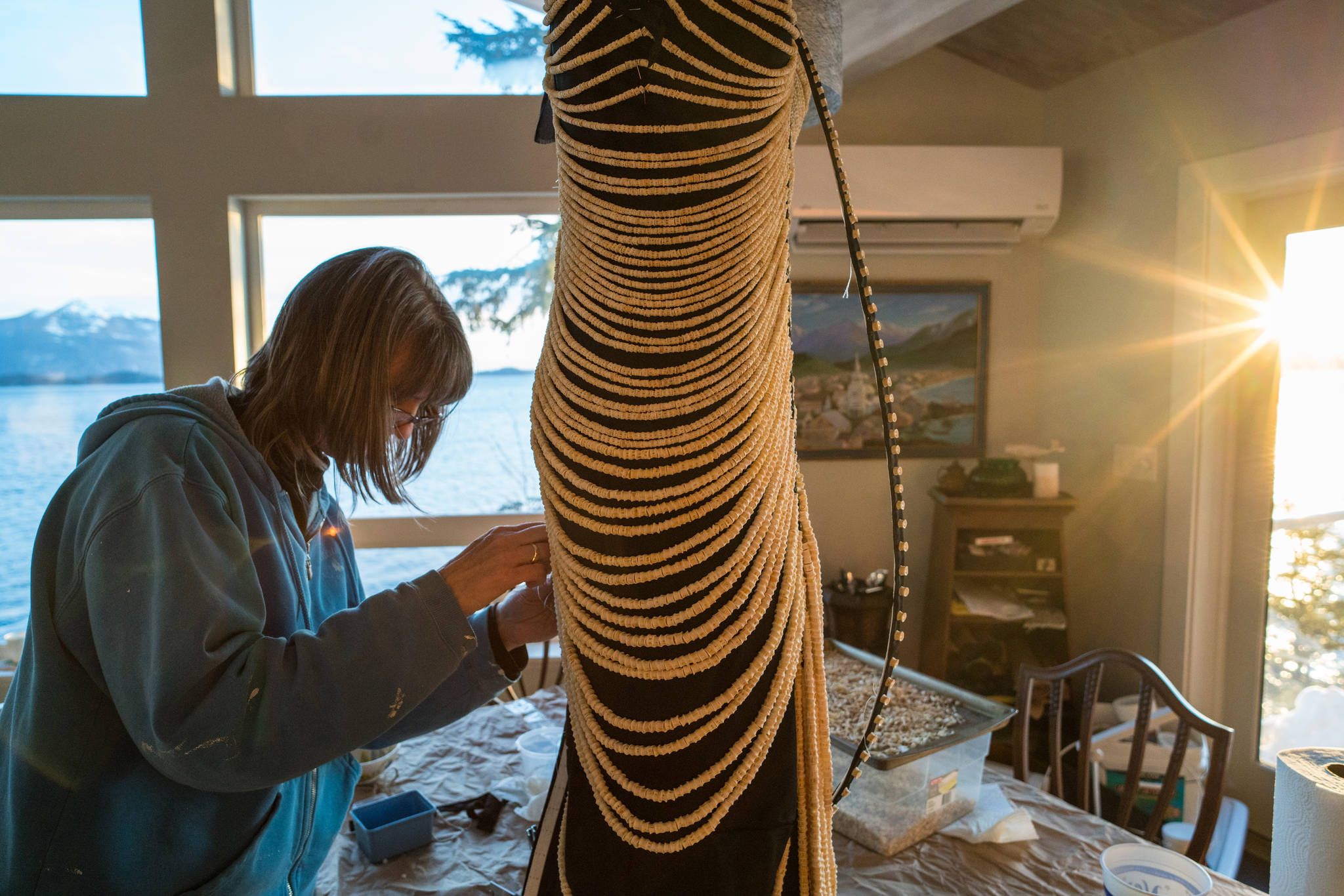 Cynthia Gibson works with 20,000 salmon bones in Sitka. (Photo by Bethany Goodrich)